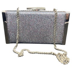 An amazing Jimmy Choo Silver Fine Glitter Fabric and Metal Clutch Bag