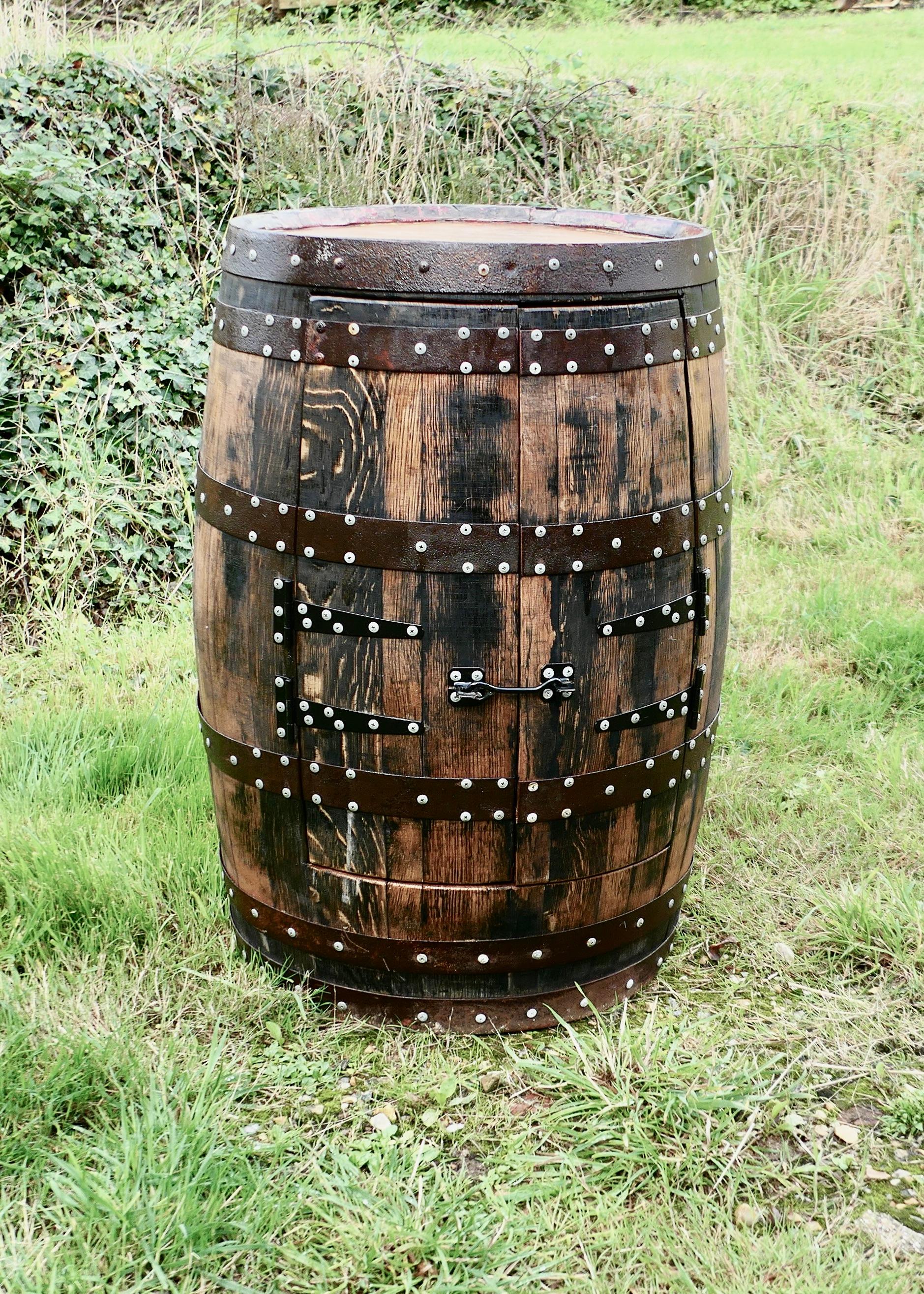 An Amazing Piece made from a Scottish Oak Whiskey Barrel 

The Cabinet is heavy, made in seasoned Oak which to get the circular shape has to be made by a Cooper with iron bands to hold it together, the barrel still retains a little of the beautiful
