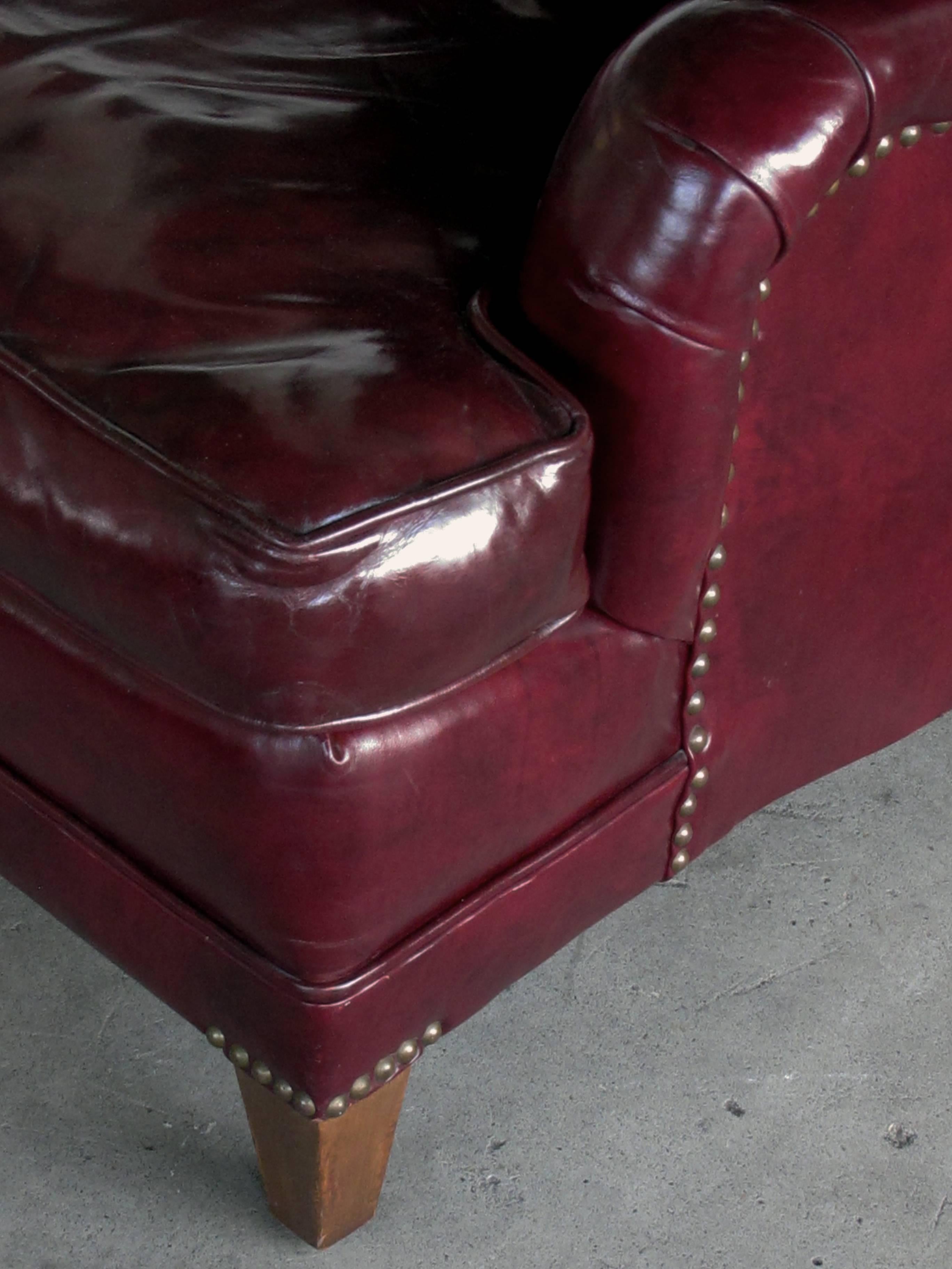 burgundy leather chair and ottoman