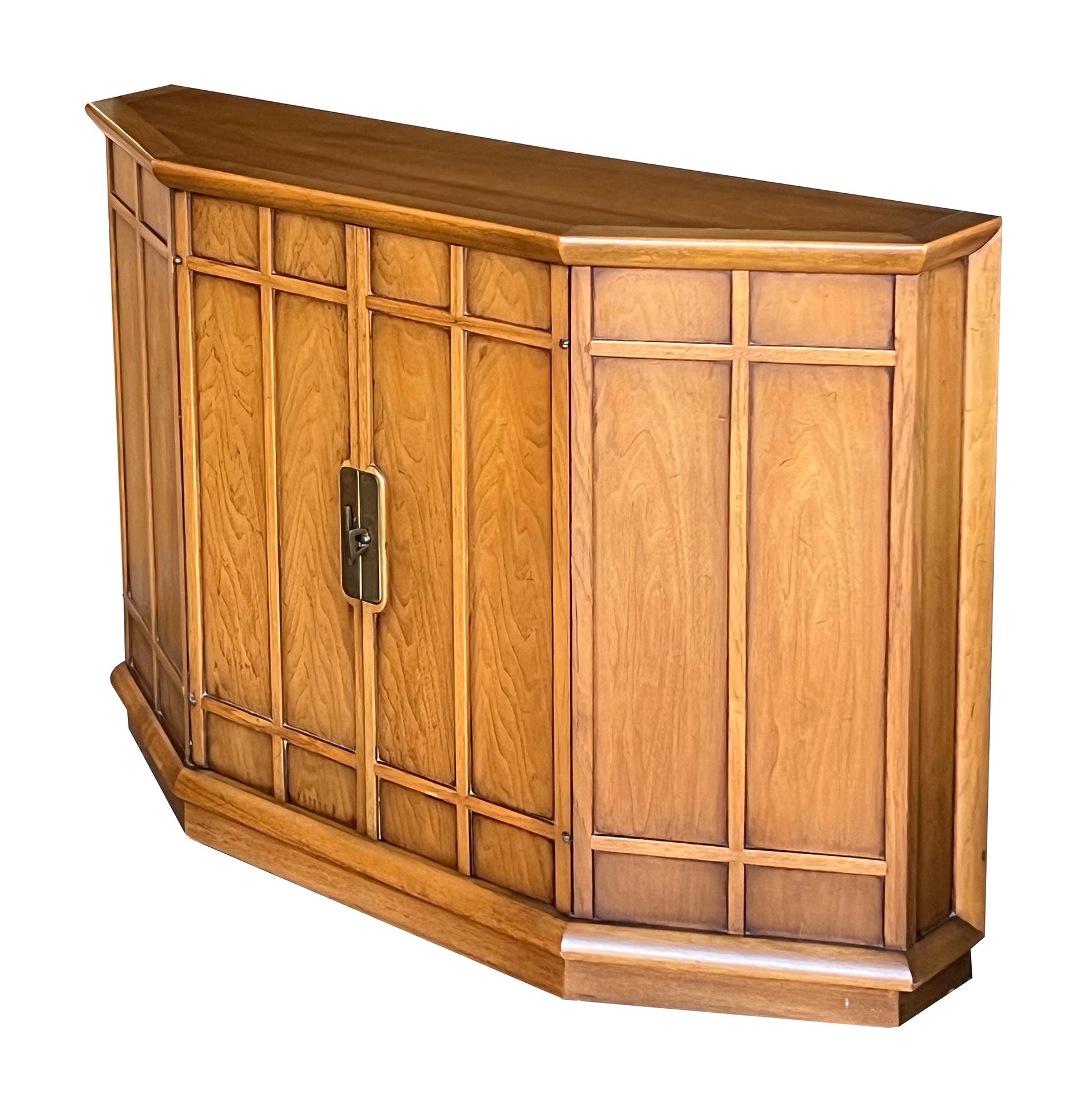 the 3-sided top above a paneled conforming body centering double-doors fitted with a solid brass latch; John Van Koert was a prominent New York designer who helped promote the fascination with Danish modern furnishings in the 1950's. In 1954, he was