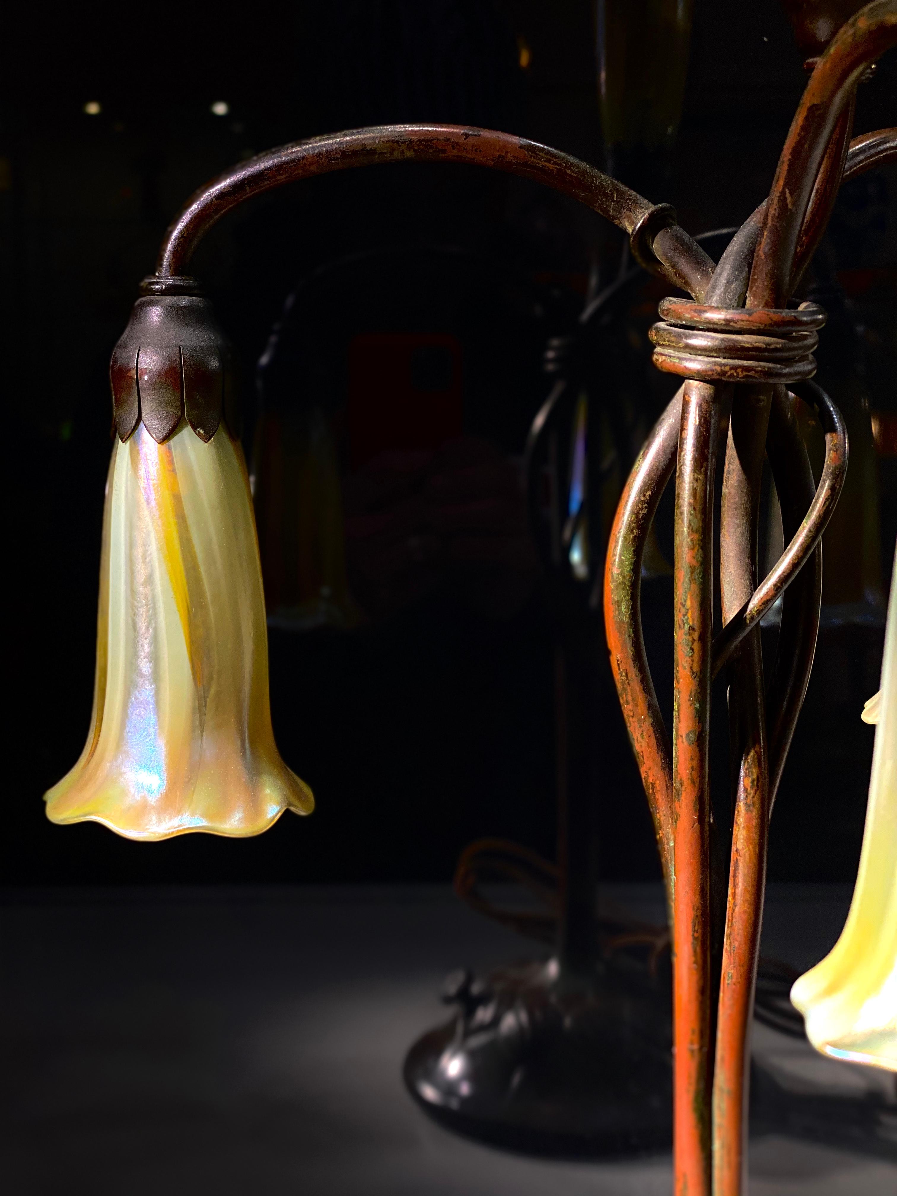 Patinated An American Art Nouveau Four-Light Lily Table Lamp by, Tiffany Studios 