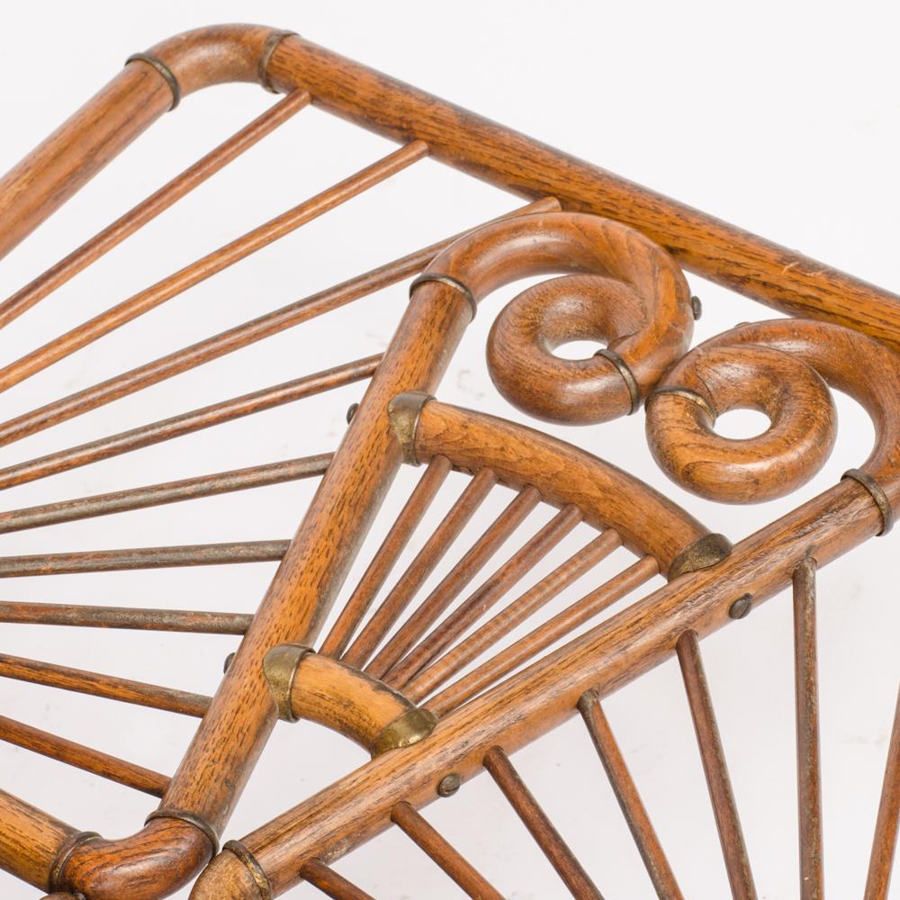 A charming and rare carved American oak stick and ball magazine rack, circa 1890.
