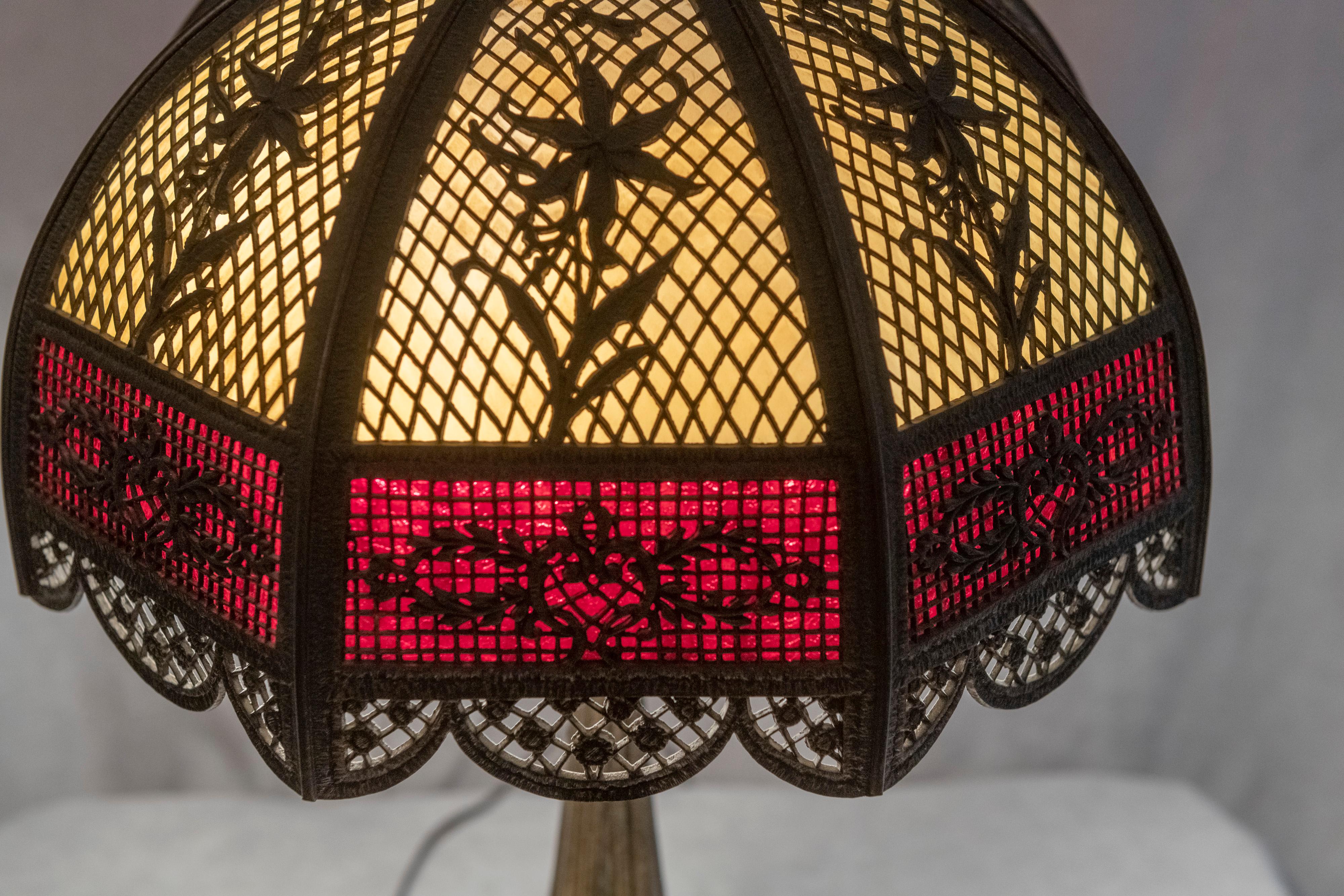 A top of the line panel lamp by Bradley & Hubbard, well known for producing some of the best panel lamps at the early part of the 20th century. The overlay is very attractive and there is plenty of it. The rich ruby red lower section of glass is a