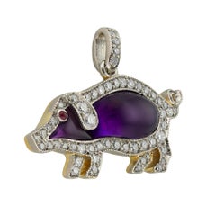 An amethyst and diamond pig pendant