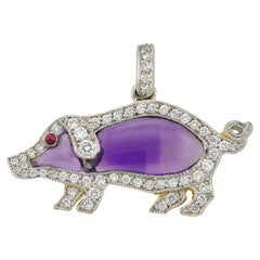 An amethyst and diamond pig pendant