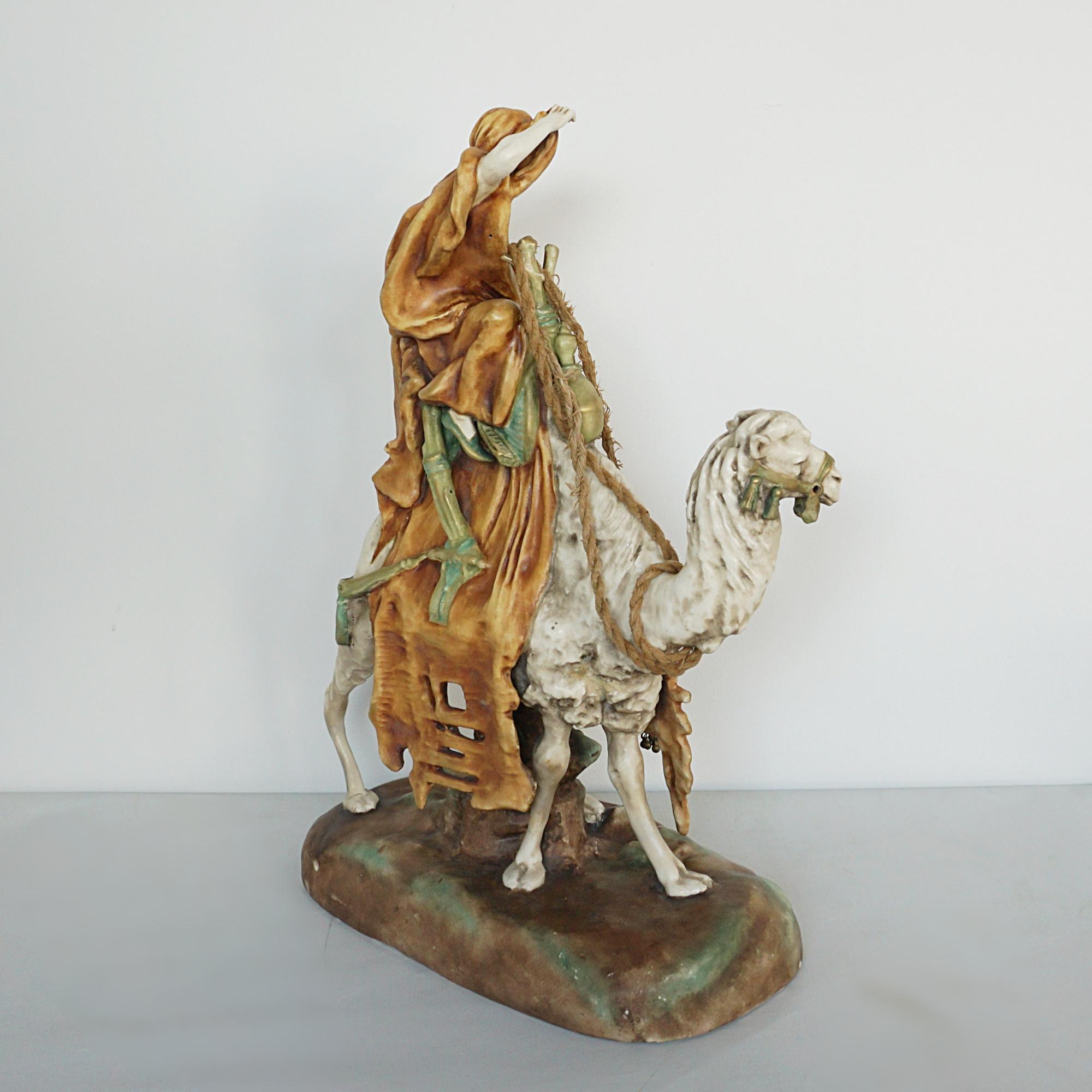 An Amphora Glazed Pottery Figure of a Camel and Rider 1