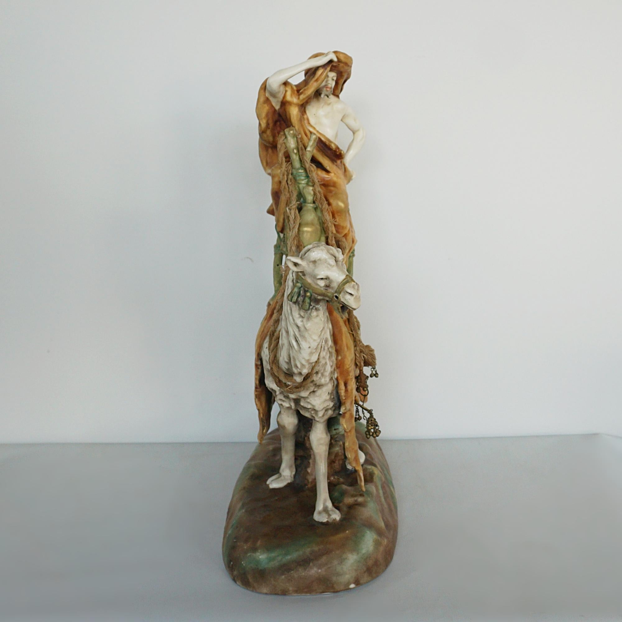 An Amphora Glazed Pottery Figure of a Camel and Rider 2