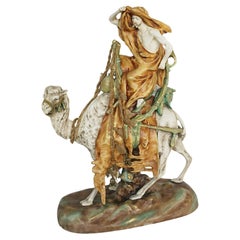 An Amphora Glazed Pottery Figure of a Camel and Rider