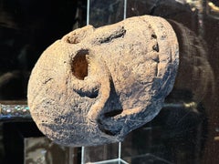 An ancient Papua wooden substitute headhunters's head