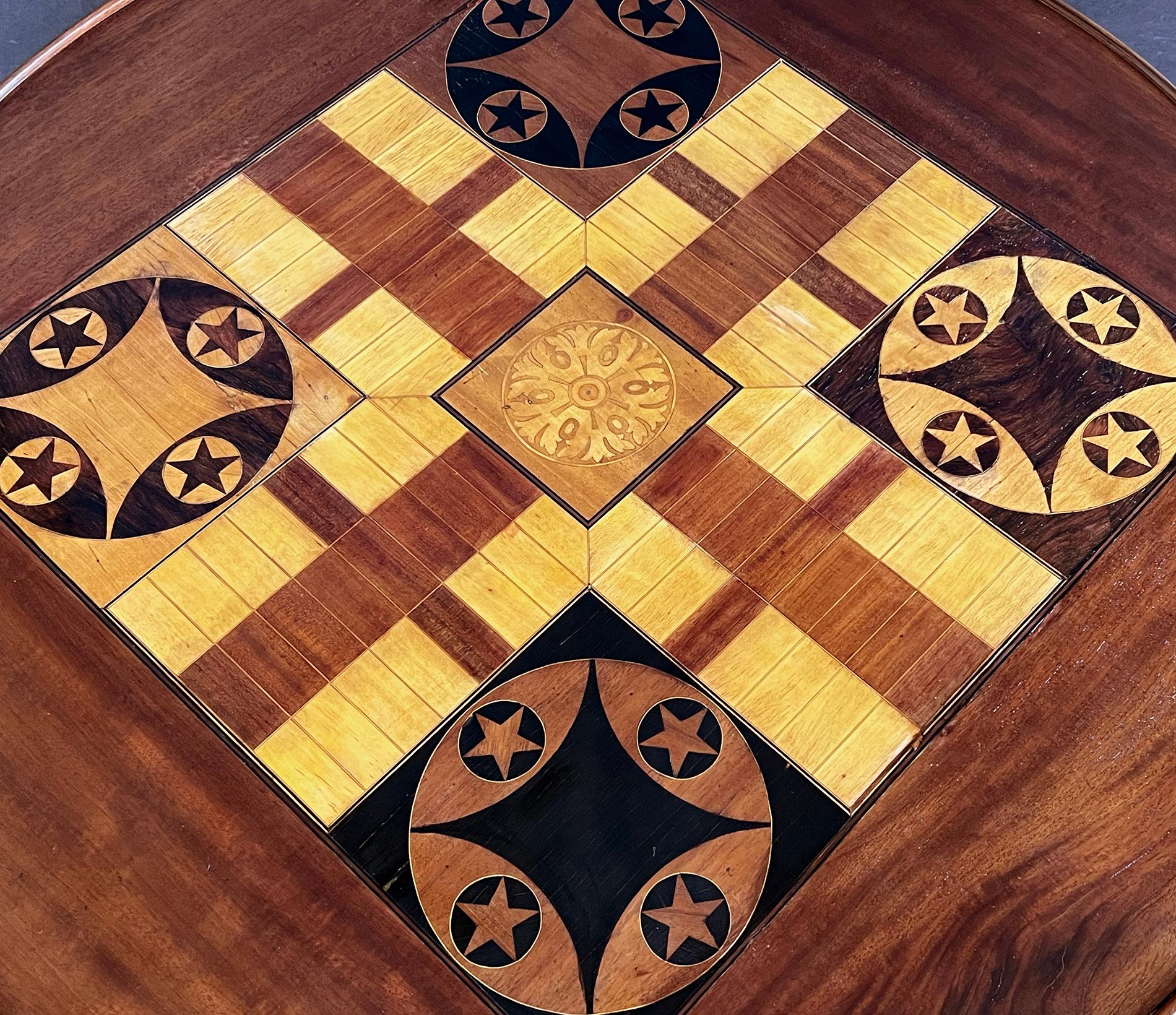 Wood An Anglo Indian Circular Inlaid Game Table with Hinged Flip Top For Sale
