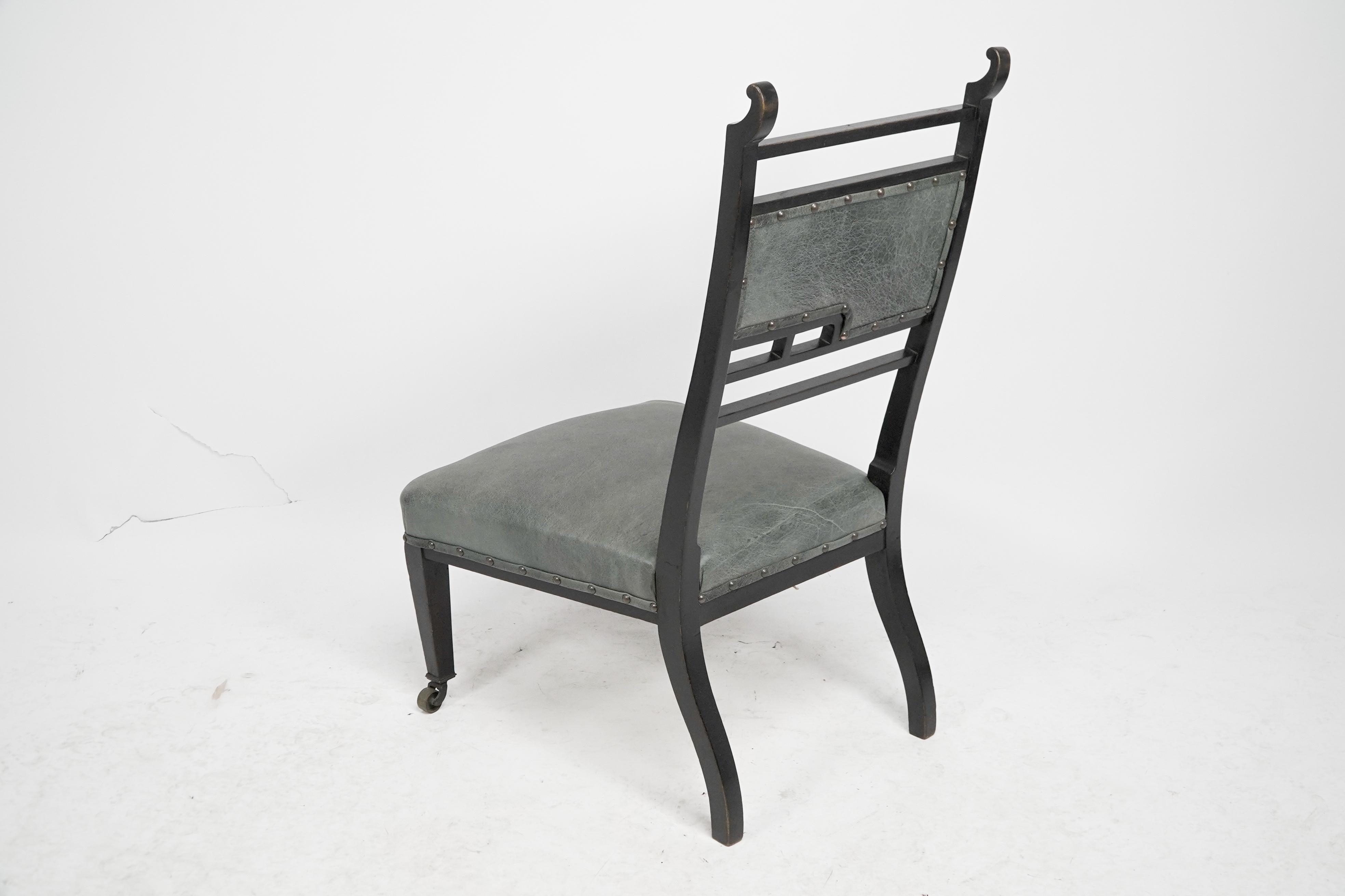 An Anglo-Japanese ebonized side or nursing chair with green hide upholstery For Sale 13
