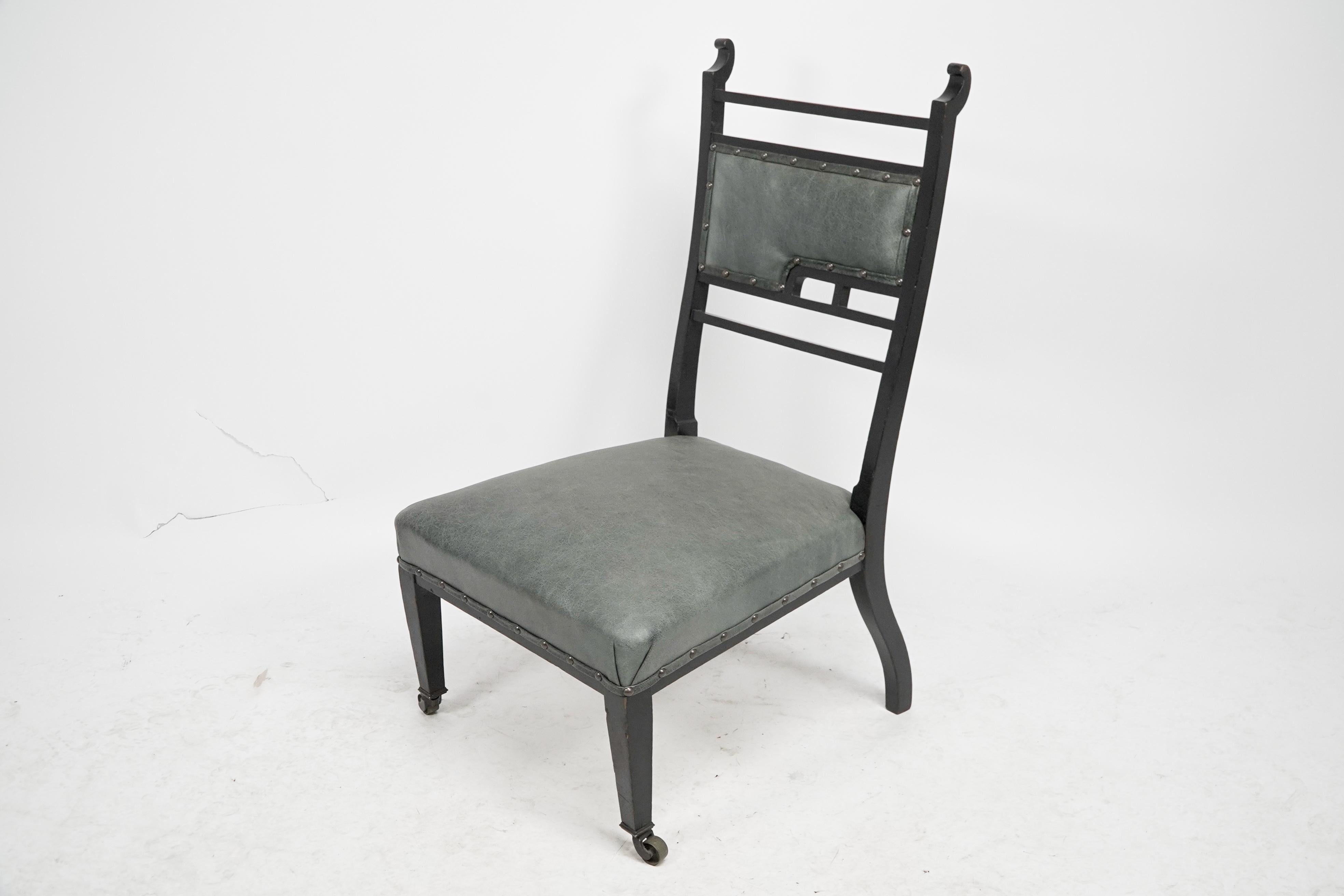 Ebonized An Anglo-Japanese ebonized side or nursing chair with green hide upholstery For Sale