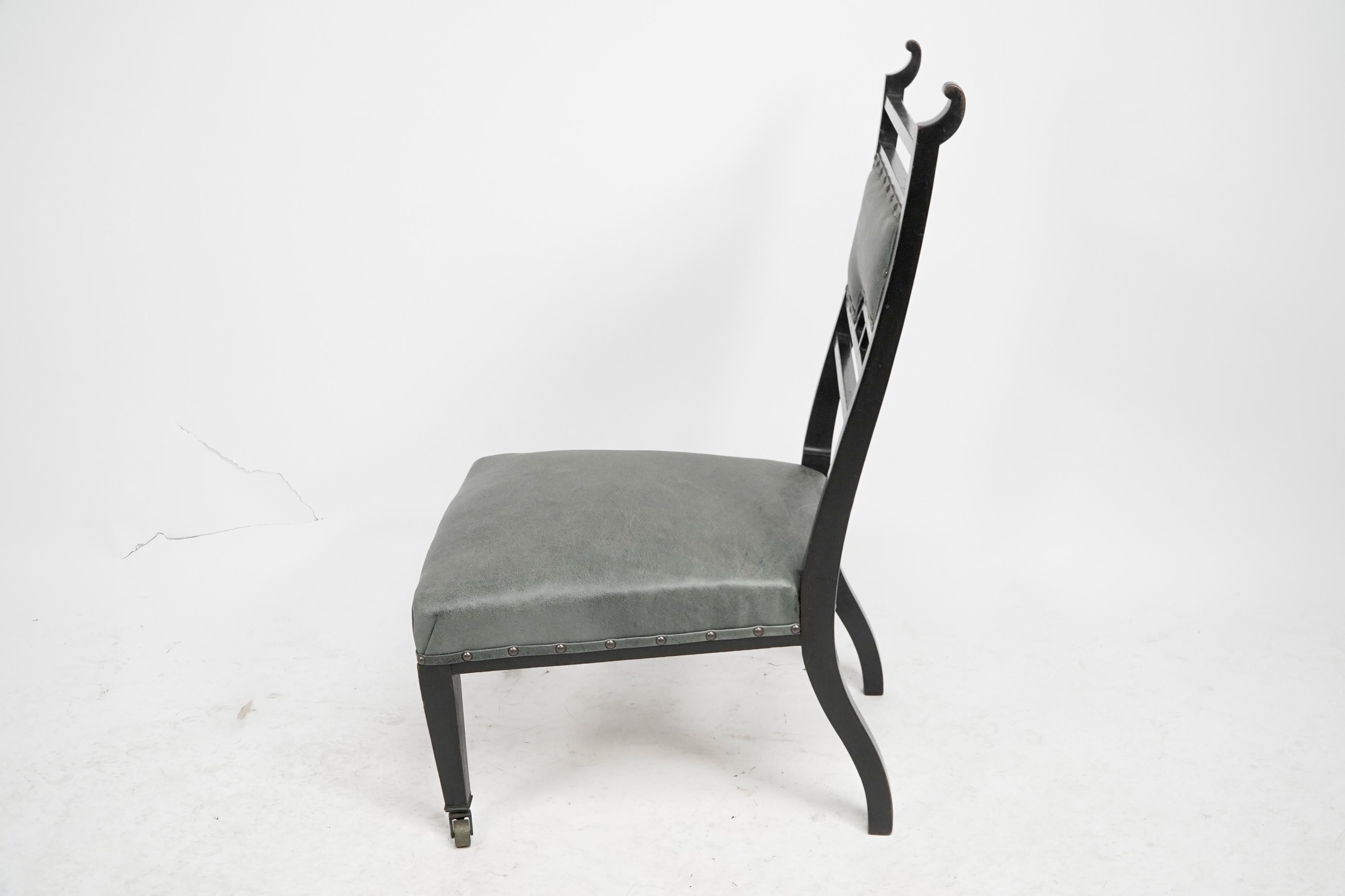 Late 19th Century An Anglo-Japanese ebonized side or nursing chair with green hide upholstery For Sale