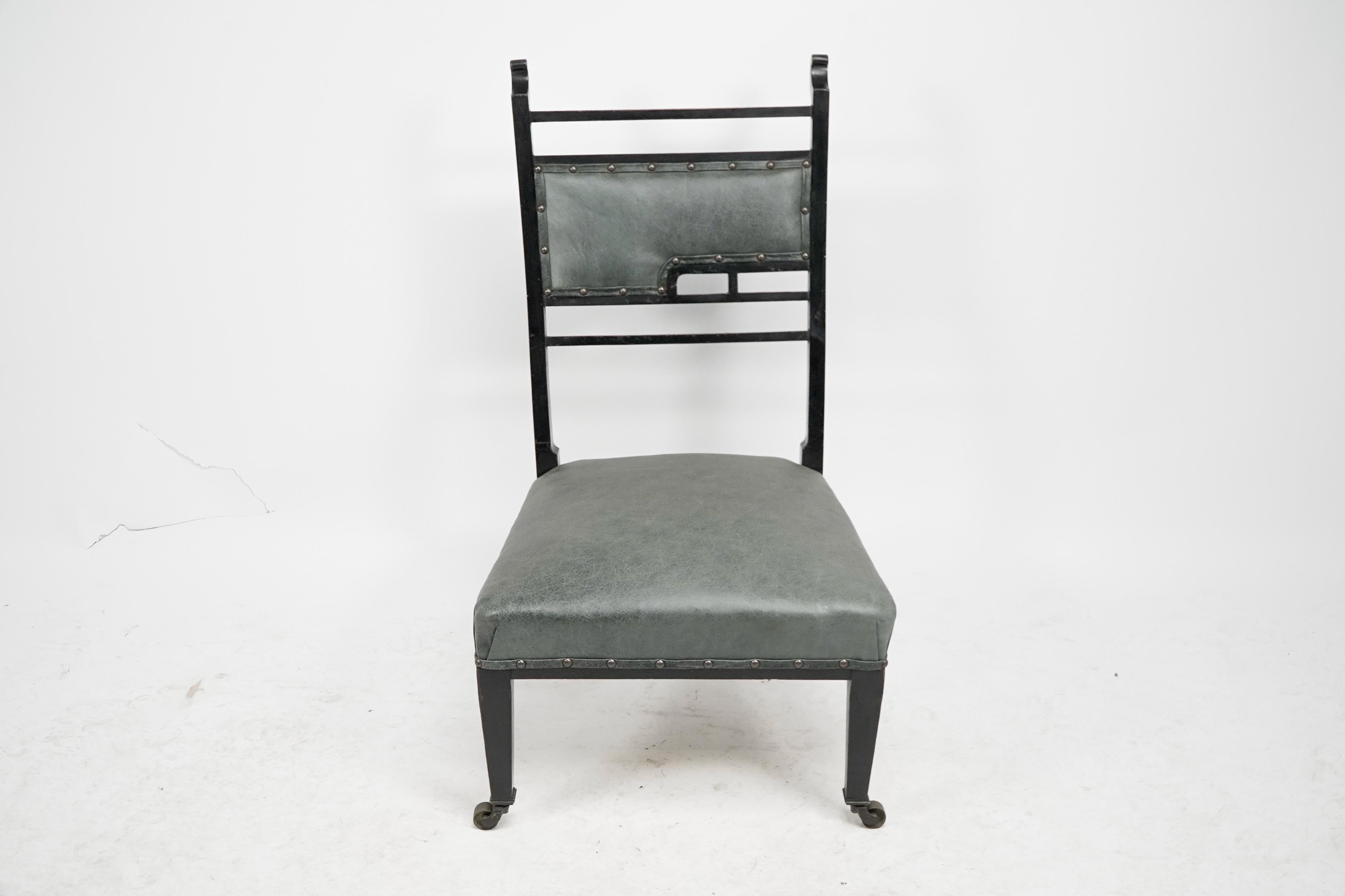 English An Anglo-Japanese ebonized side or nursing chair with green hide upholstery For Sale