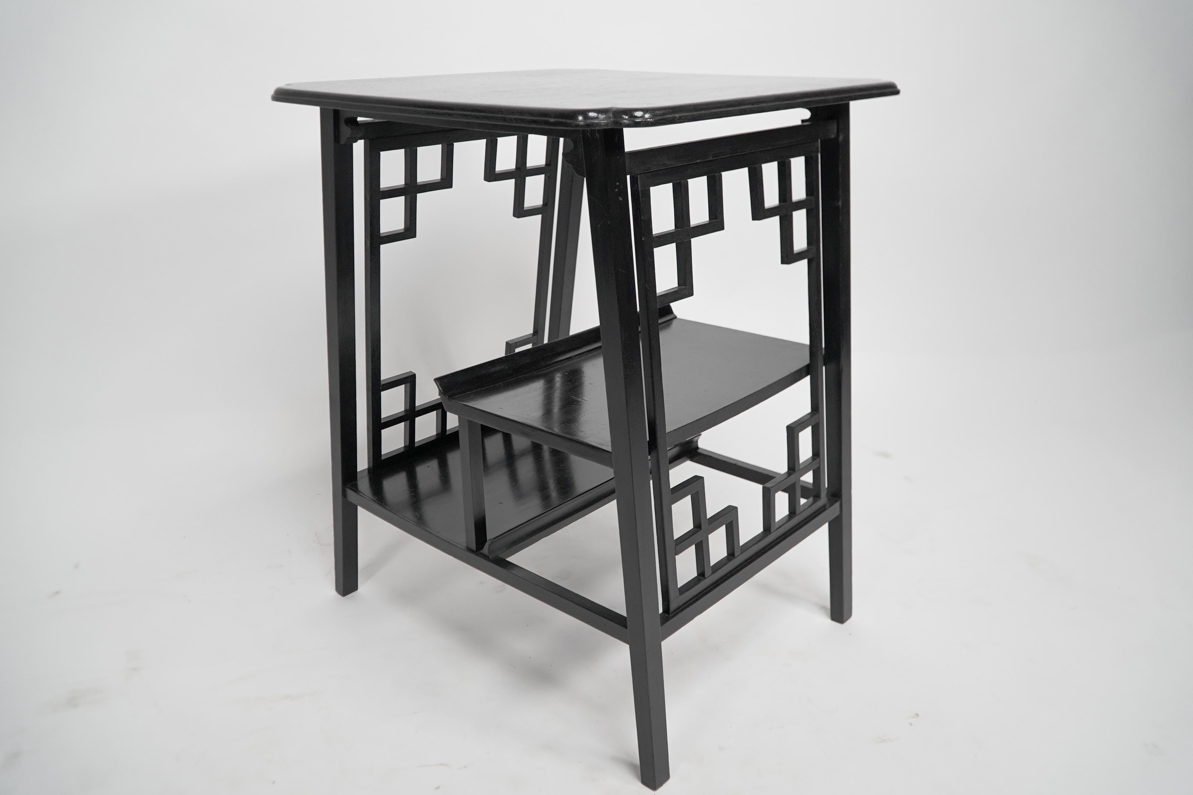 A Scottish Anglo-Japanese ebonized side table with fretwork & hand carved edges. In Good Condition For Sale In London, GB