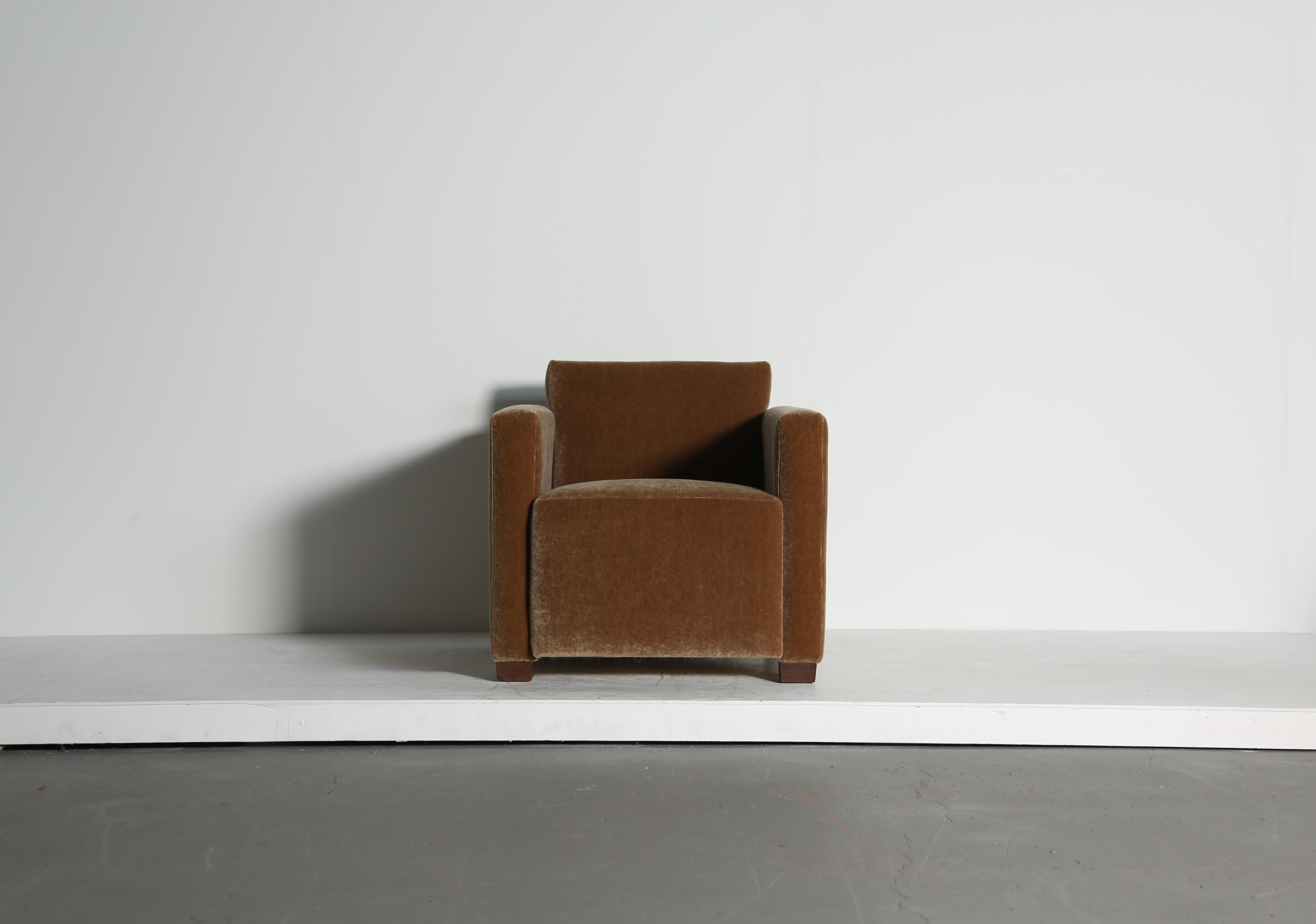 A superb modern angular club armchair.  High quality handmade beech frames and sprung seats.  Newly upholstered in a premium soft, pure mohair fabric.  Fast shipping worldwide.



