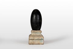 An Aniconic Lingam on a Stone Base