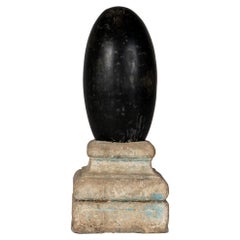 An Aniconic Lingam on a Stone Base