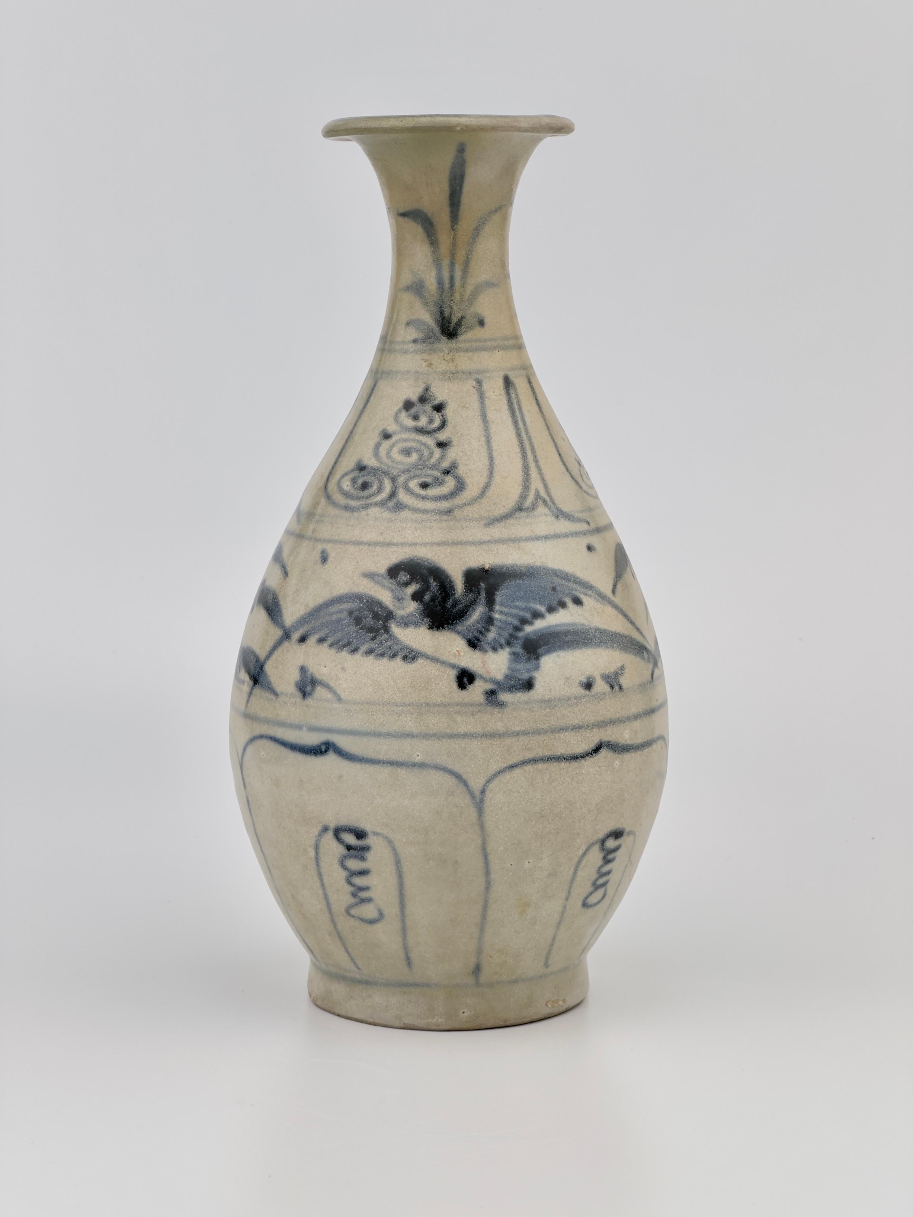 Lively birds flit across the body of this pear-shaped vase. The cobalt blue of the underpainting remains dark, even though the clear glaze of the surface has worn away after centuries under the sea. There was remarkable variation in the condition of