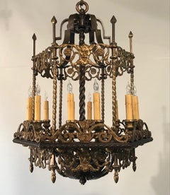 An Antique 12 Light Neo-Renaissance  Bronze and Wrought Iron Chandelier