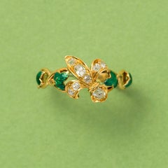 Antiker 18 Karat Goldring mit einem Fleur De l'ys-Diamant und grünem Emaille- Efeu