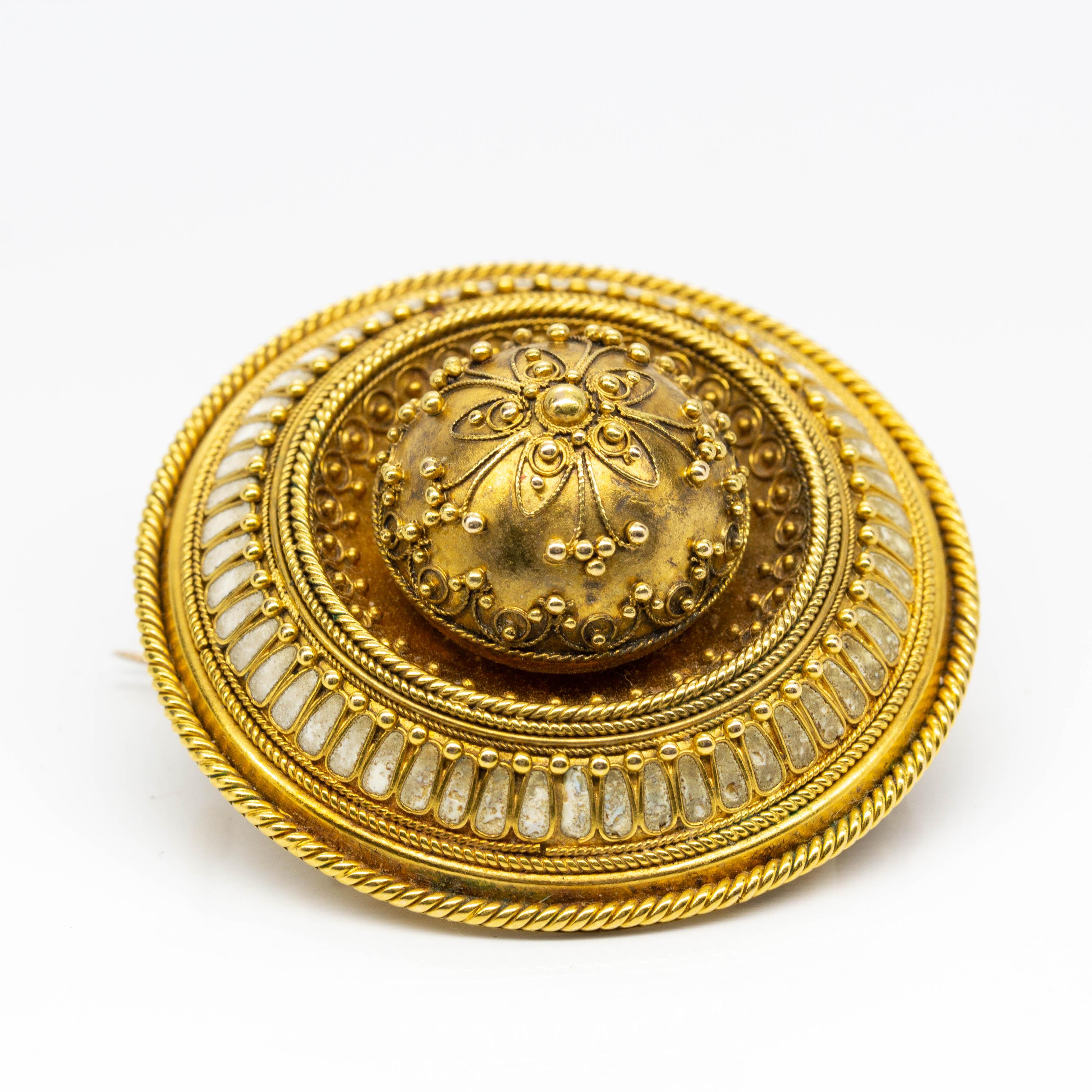 •	Early Victorian
•	18k gold
•	A brooch with white enamel measuring 38mm by 16 mm
•	A pair of earrings measuring 53mm by 13mm by 10mm
•	Brooch weight: 17.9 grams/ 11.50 dwt 
•	Earrings weight 5.60 grs 3.60 dwt
