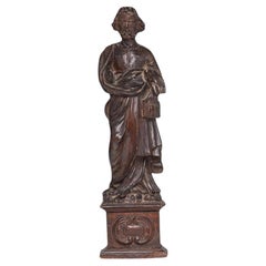 An antique 18th century Walnut European Santos - Saint figure on a plinth