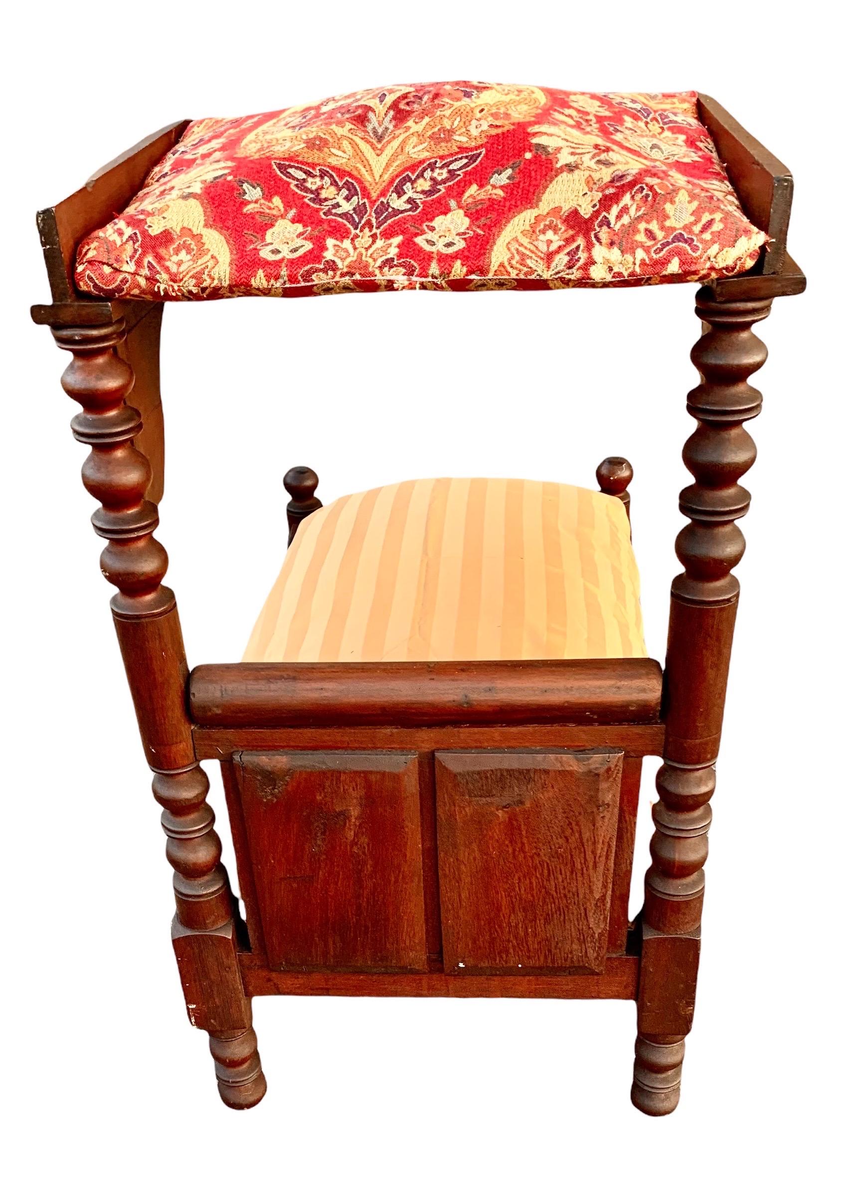An antique 19th century Eastlake carved walnut American doll bed or the ultimate sleeping chamber for your beloved pet. The half tester now upholstered in a tapestry and the bedding is a king size pillow with pillow slip that can both be washed. Of