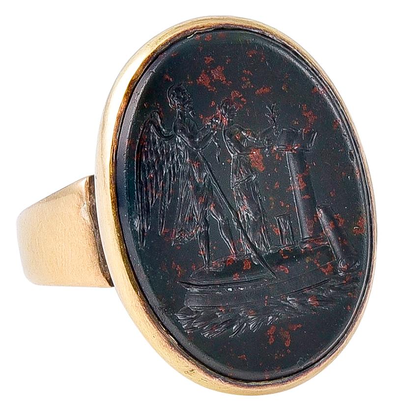 The reverse of the head is faintly engraved PH to GJW April 22 1870
and with an 18k mark in the shank. The Bloodstone Intaglio, which is both bizarre and thought provoking, shows on the left the winged and bearded Grim Reaper standing behind a young