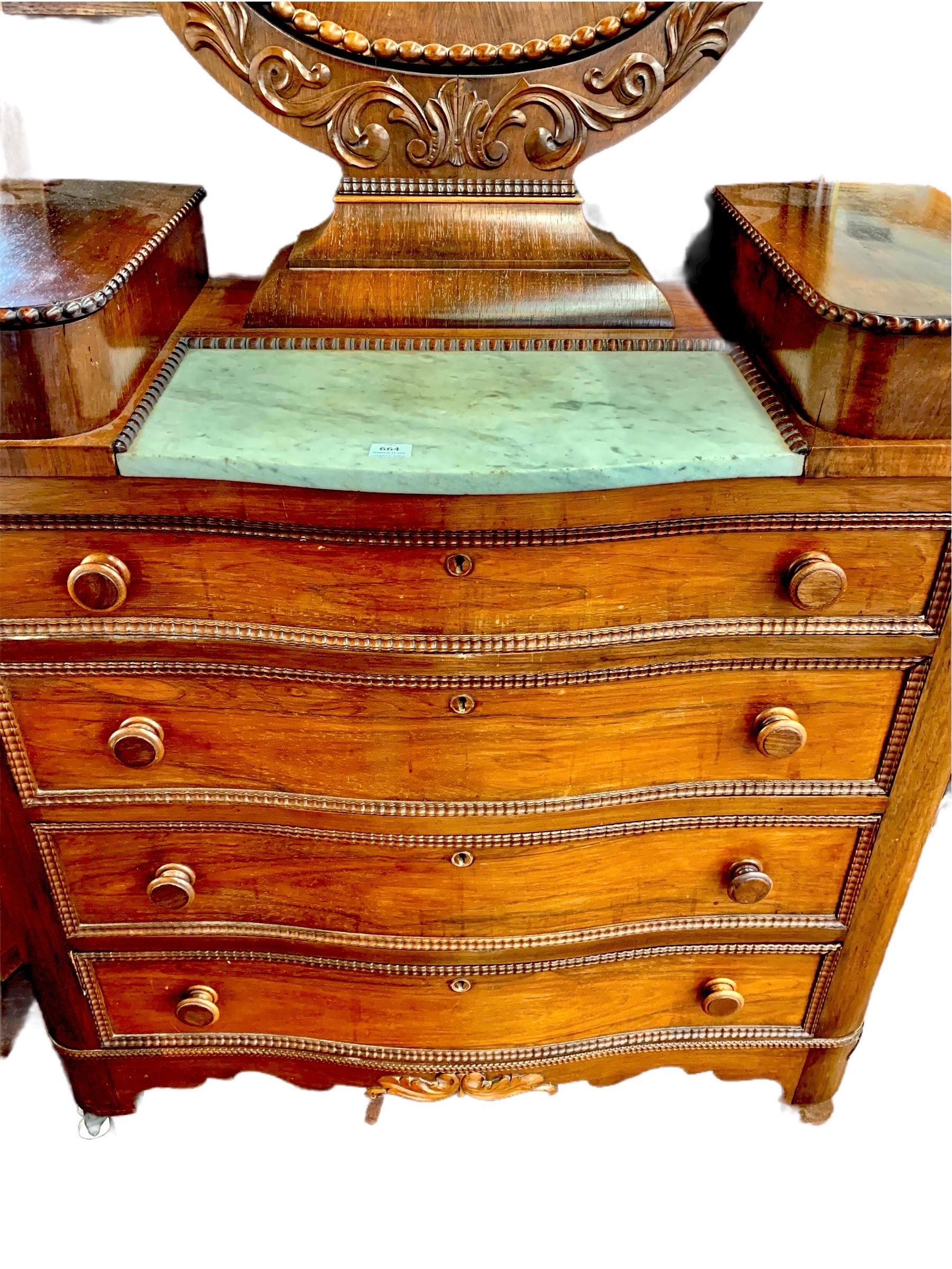 A stunning antique American Classical rosewood dresser and yoke mirror having two lift top glove drawers, a Carrera marble top and four serpentine drawers below, on double porcelain casters. There is delicate beading around the mirror and glove