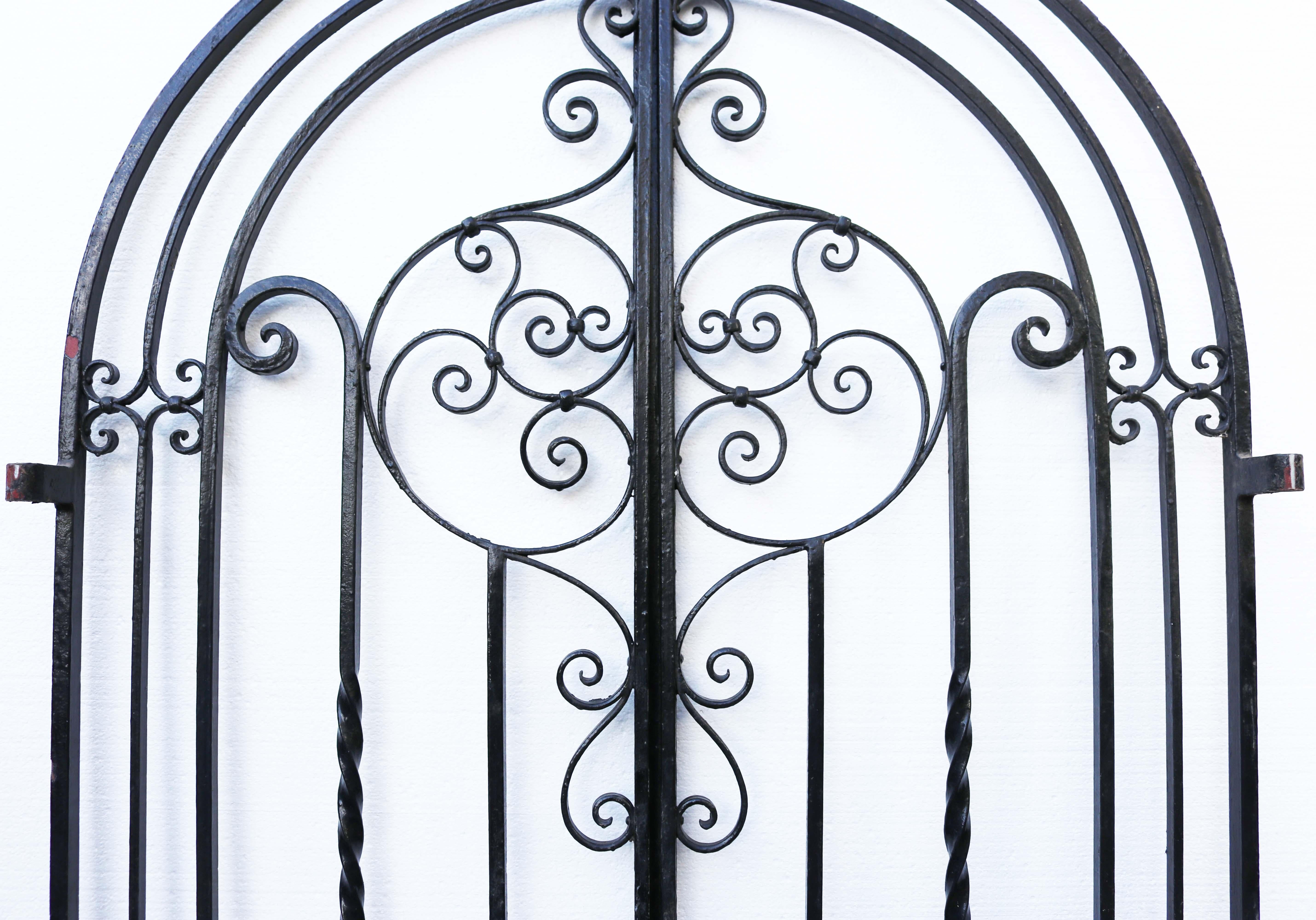 An attractive arched wrought iron gate, the lower part decorated with scroll work. This gate was salvaged from a property in Essex.

 

Condition report

Good structural condition. Working gate stay present, all hinge eyes present. No key