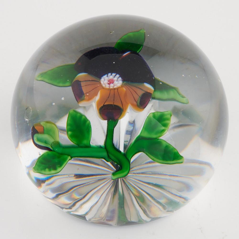 An Antique Baccarat Pansy Paperweight, c1880

Additional information:
Date : c1880
Origin : Baccarat France
Features : A lampwork pansy, leaves stem and bud on a clear ground with star cut base
Marks : None
Type : Lead
Size : Diameter 6.7 cm