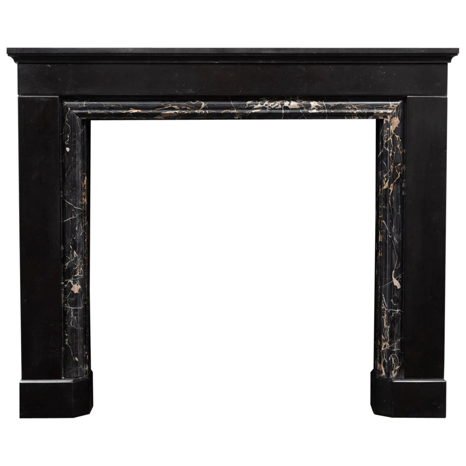 An antique black fossil and Portoro marble fireplace made during the 1830's For Sale