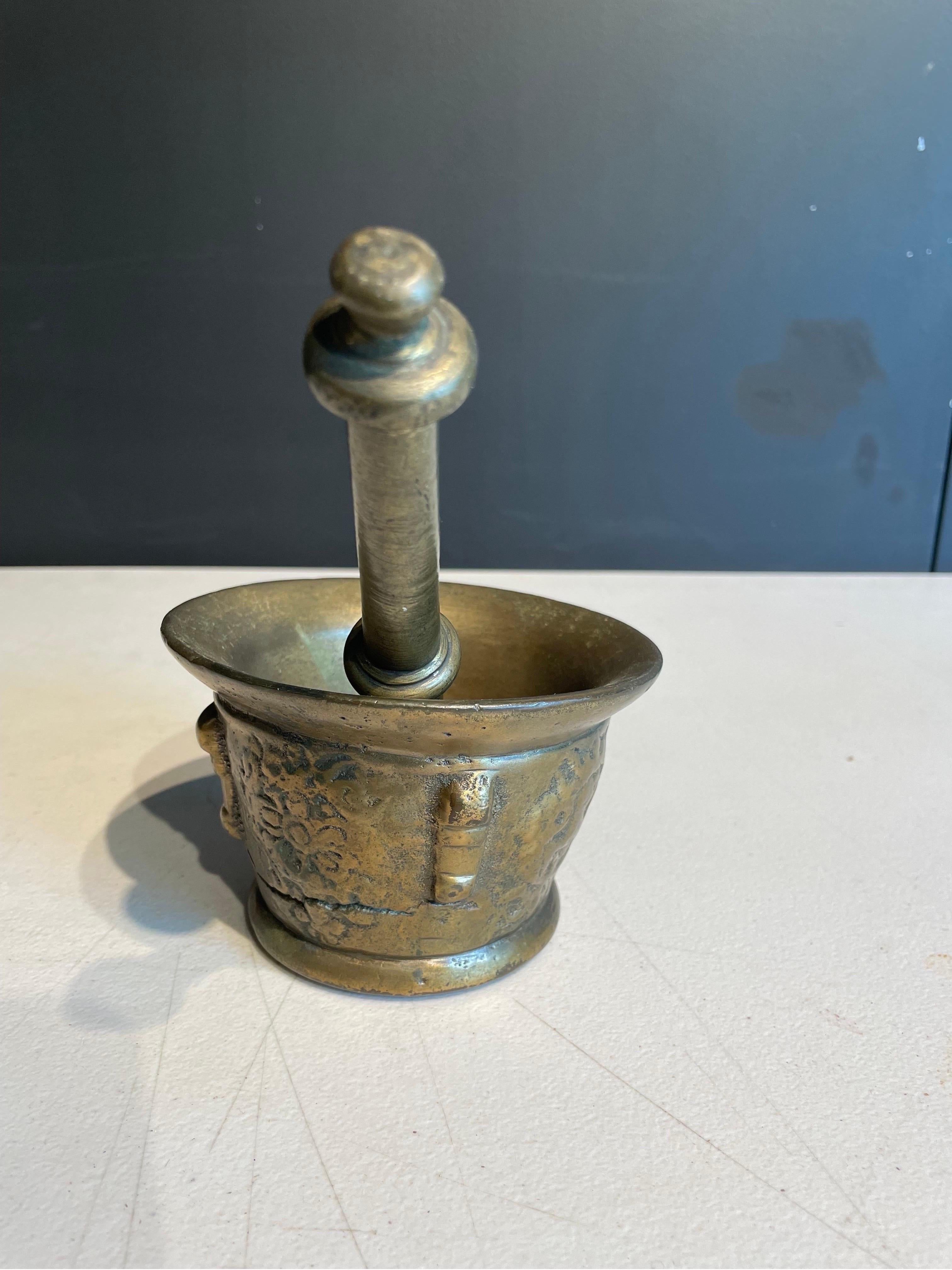 An Antique Brass Mortar with Pestle, 19th Century

Dimension: Mortar: Height: 8.4 cm Diameter: 13 cm. Pestle: Height: 20.5 cm Diameter: 4.2 cm (Widest Point) 1.5 (Narrowest Point).

Provenance: Private Sydney Collection.
