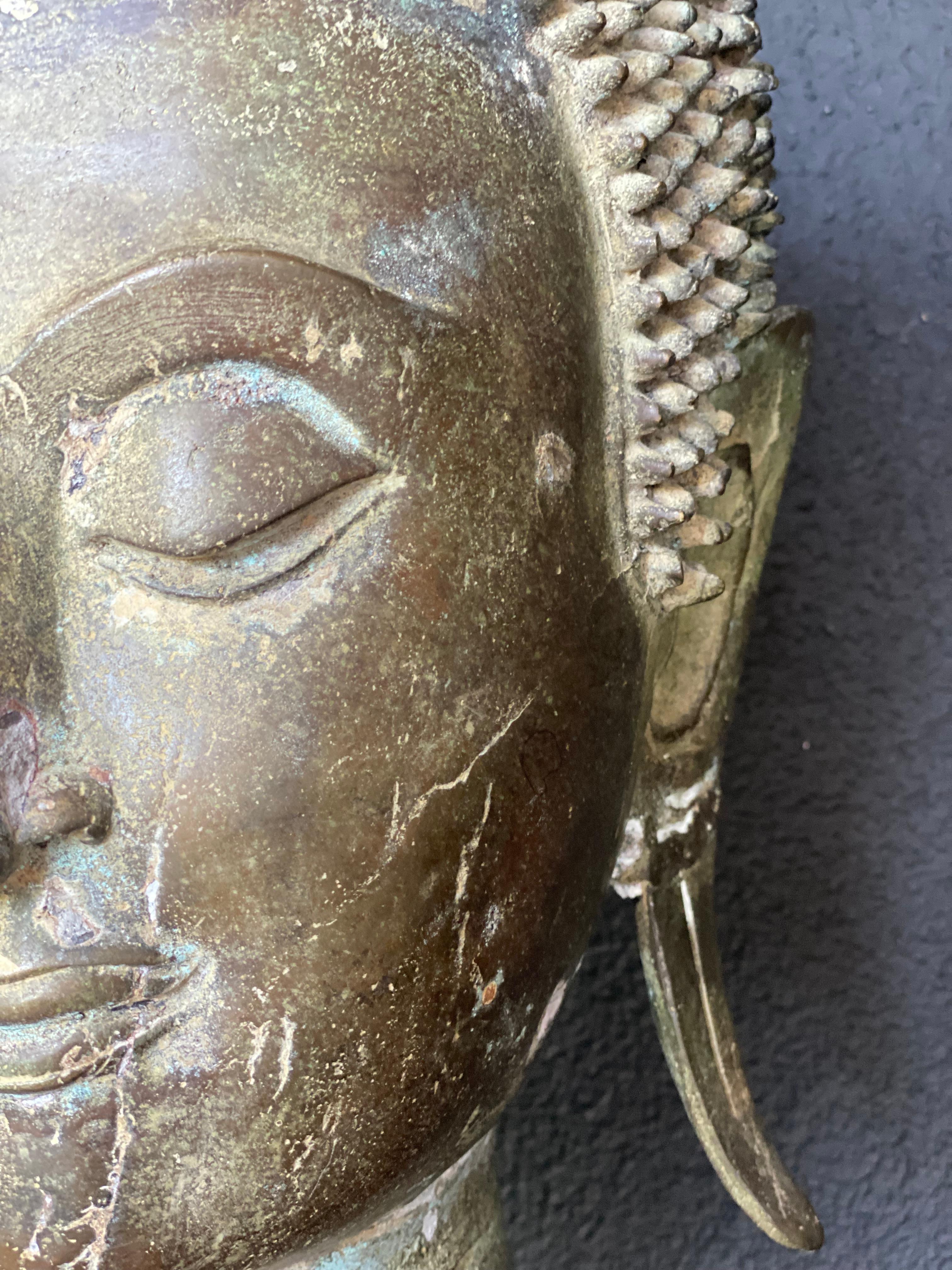 An antique Bronze Buddha Head 8