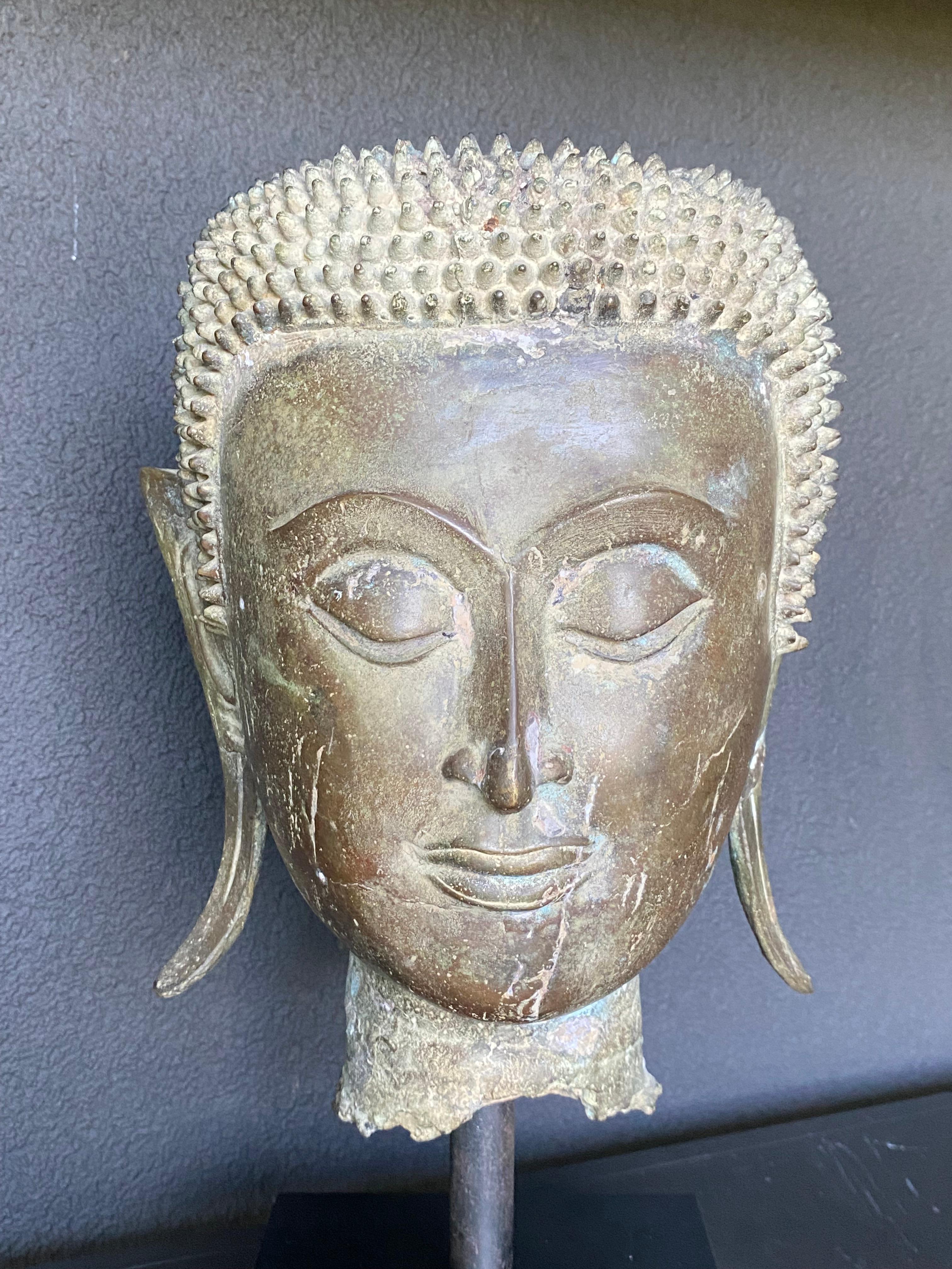 An antique Bronze Buddha Head 14