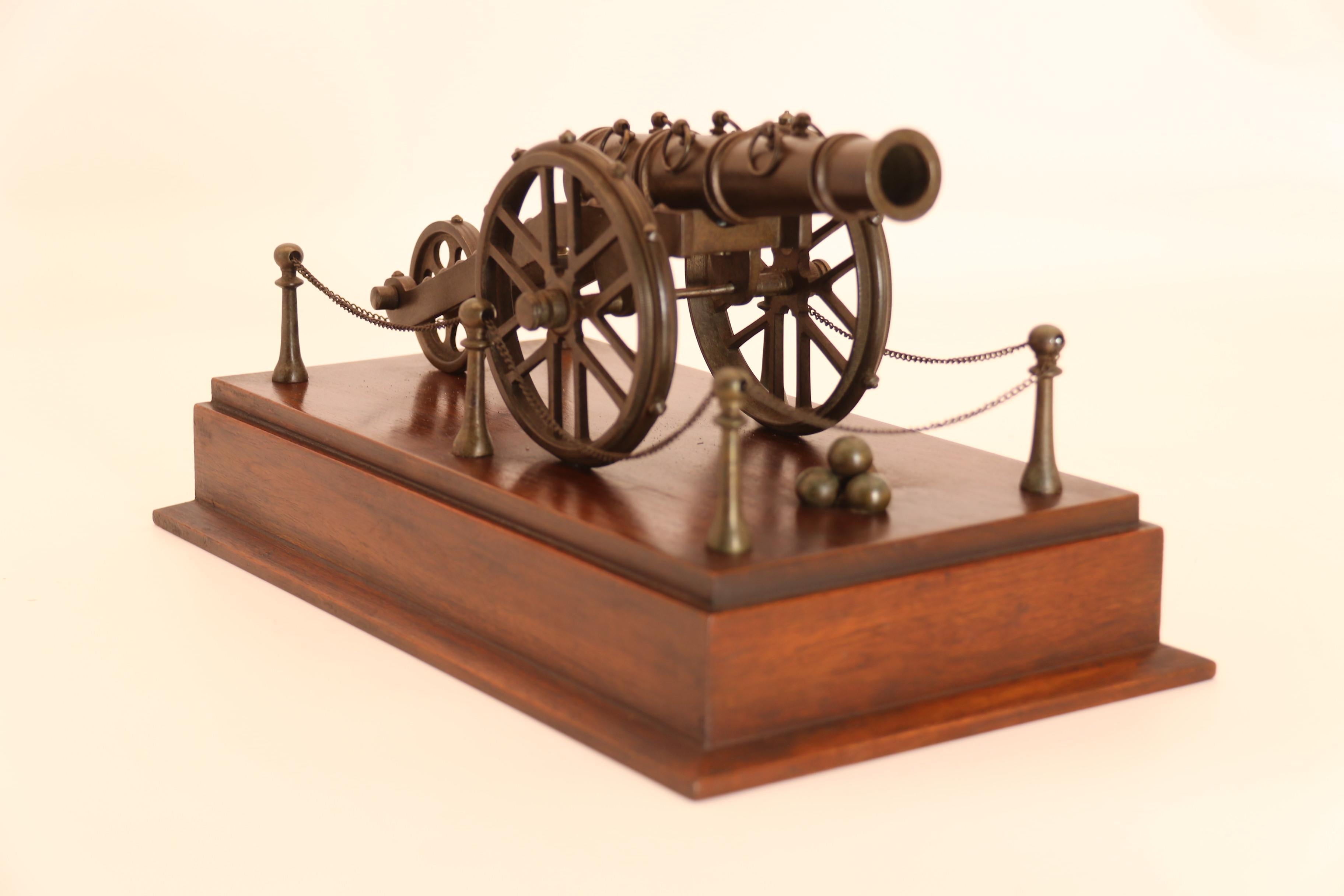 British An antique bronze scale model of an 18th century cannon on a hardwood base c1920 For Sale