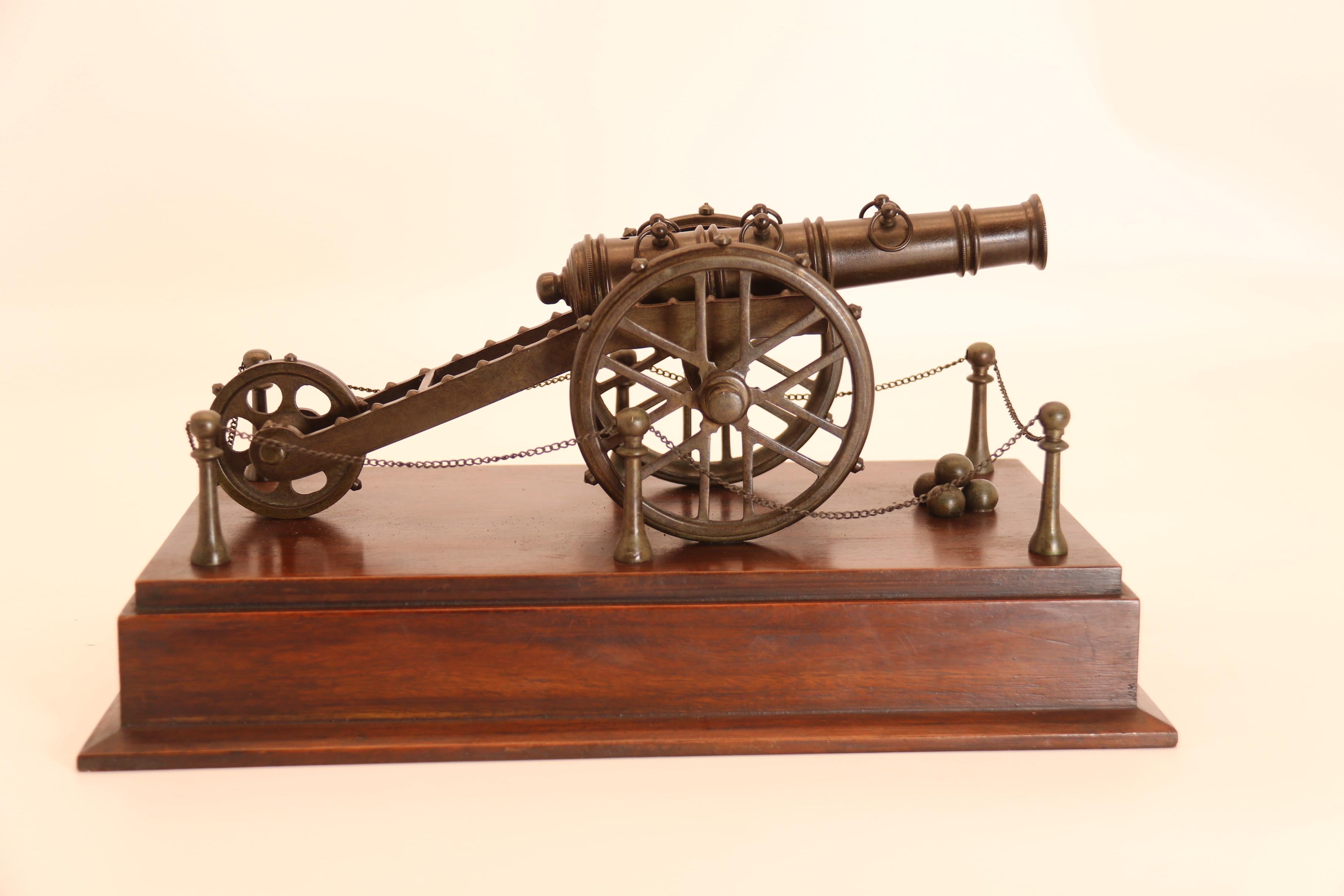 Hand-Crafted An antique bronze scale model of an 18th century cannon on a hardwood base c1920 For Sale