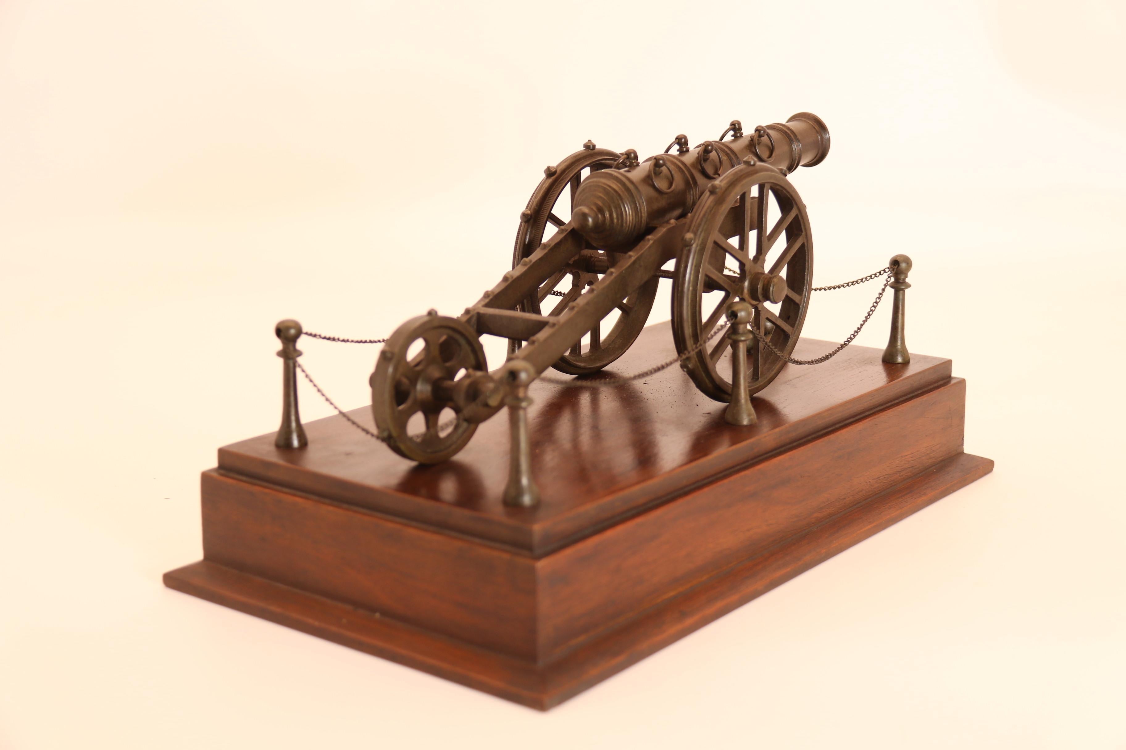 20th Century An antique bronze scale model of an 18th century cannon on a hardwood base c1920 For Sale