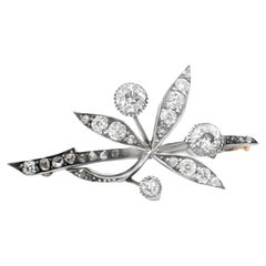 An Antique brooch in gold, silver and diamond