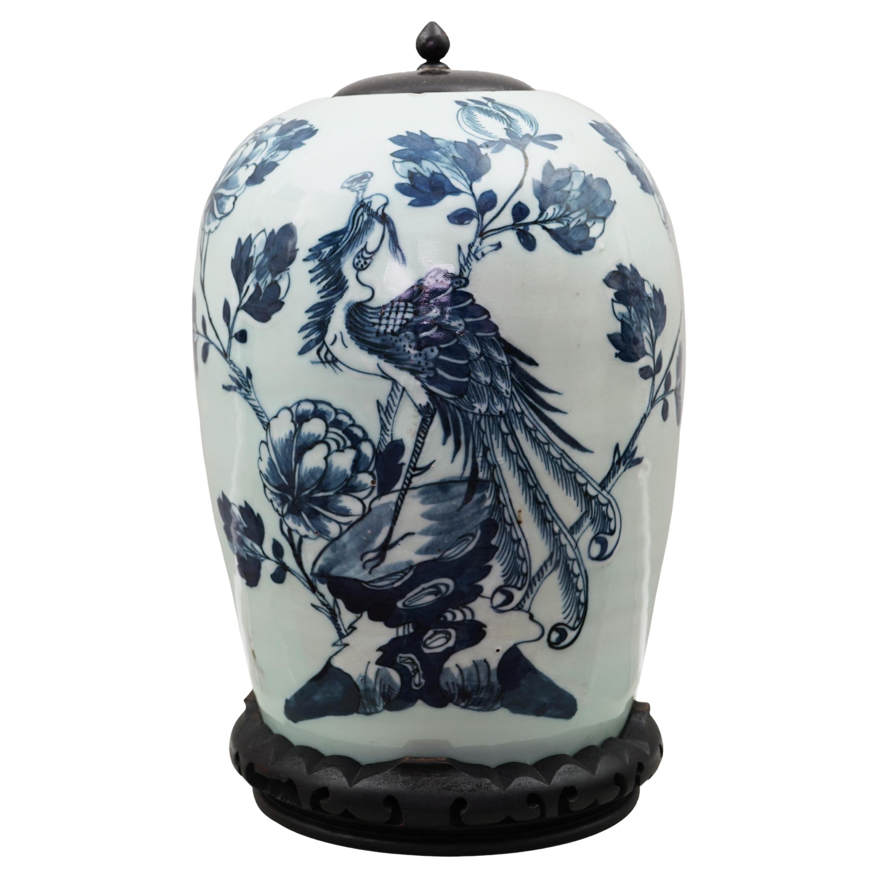 An Antique Chinese Celadon and Blue Lidded
Phoenix
Vase