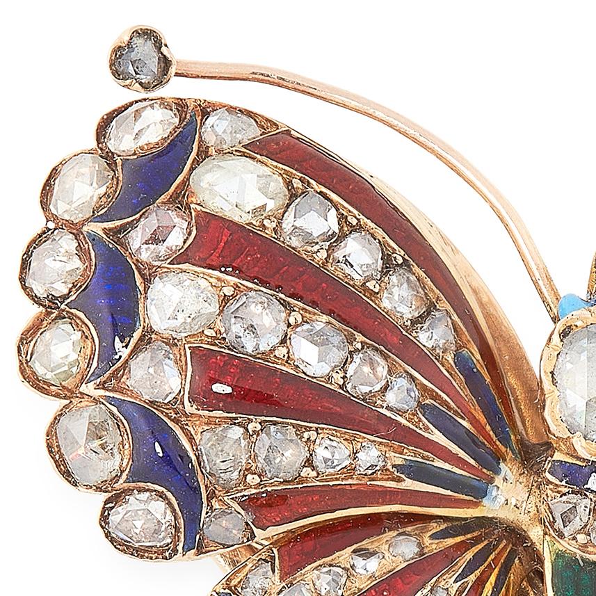An antique diamond and enamel butterfly clip brooch, designed as a butterfly, its body set allover with rose cut diamonds, interspersed with blue, green and red enamel, unmarked.

Length: 3.9cm
Gross weight: 19.6g