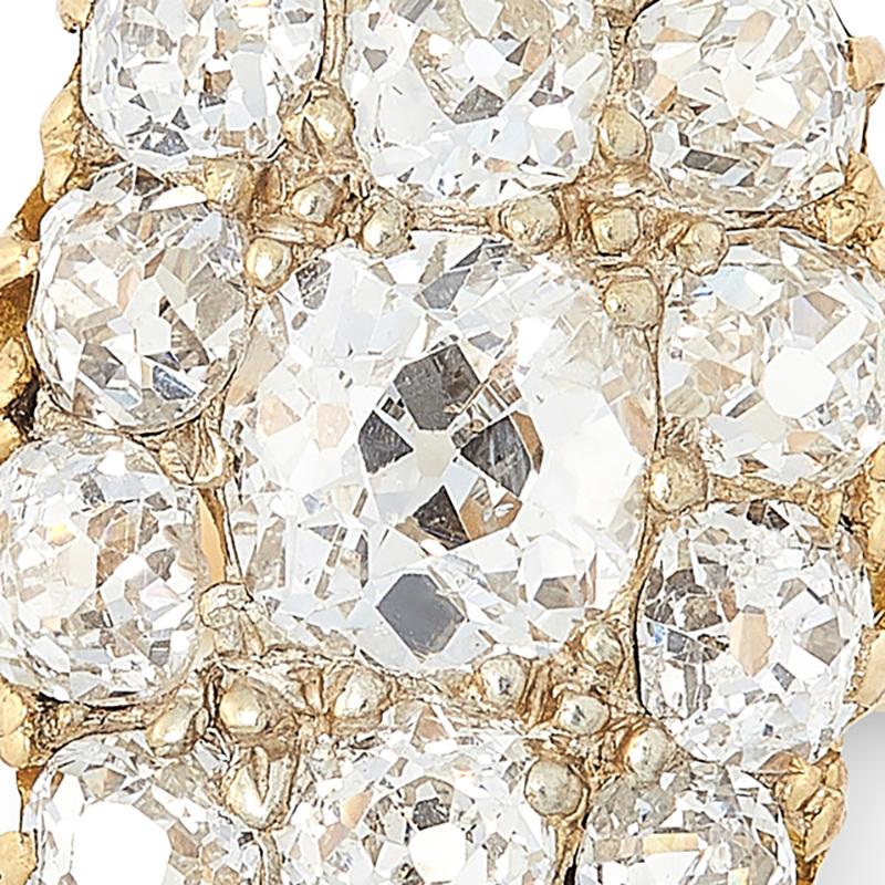 A fantastic example of an antique diamond cluster ring, set in high carat yellow gold, the navette face set with a cluster of old cut diamonds totalling 1.7-2.2 carats, unmarked. 

Size M / 6.25

Weight:  3.3g
