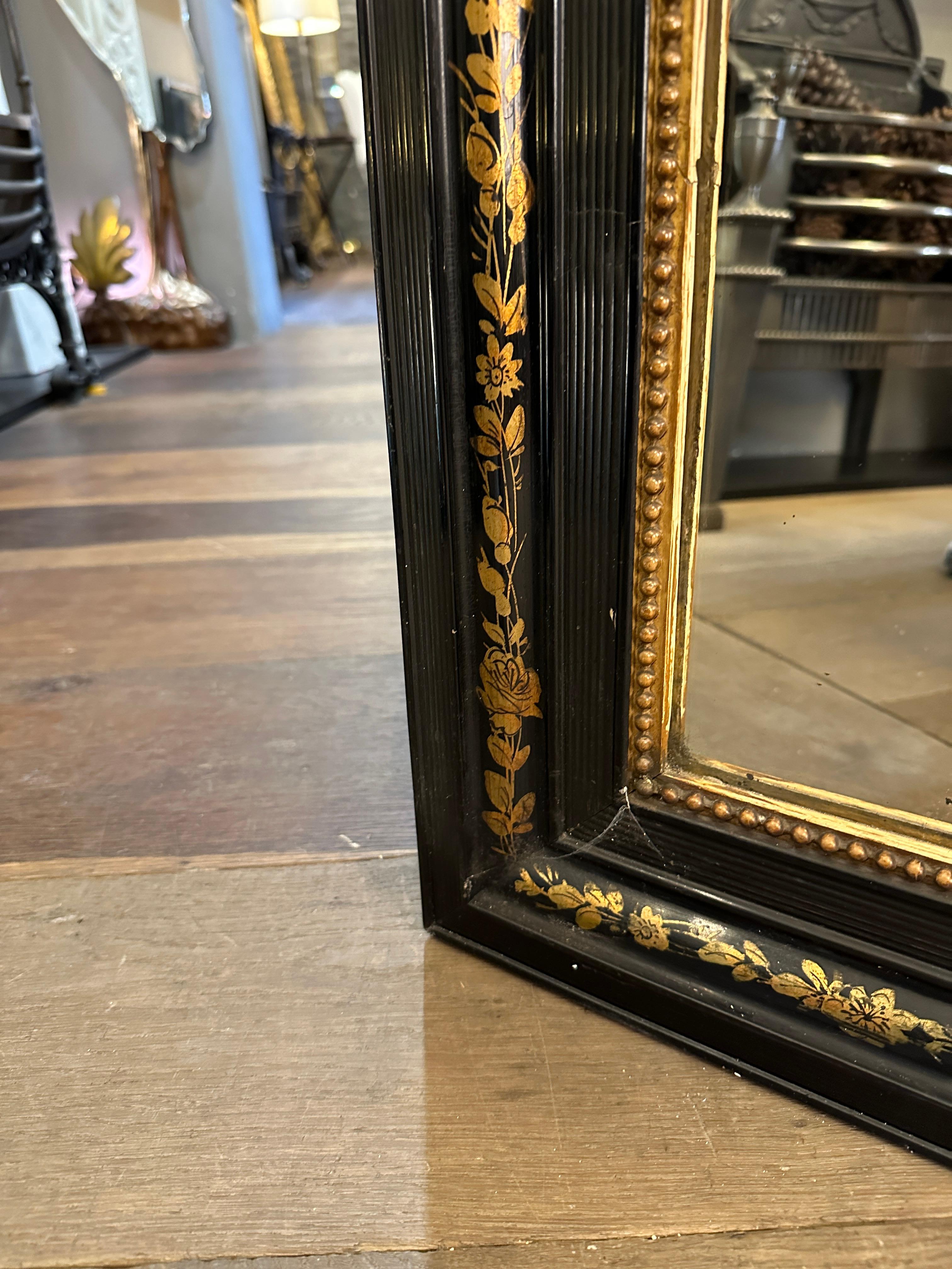 Art Nouveau An Antique Domed Topped Ebonised And Gilt  French Mirror