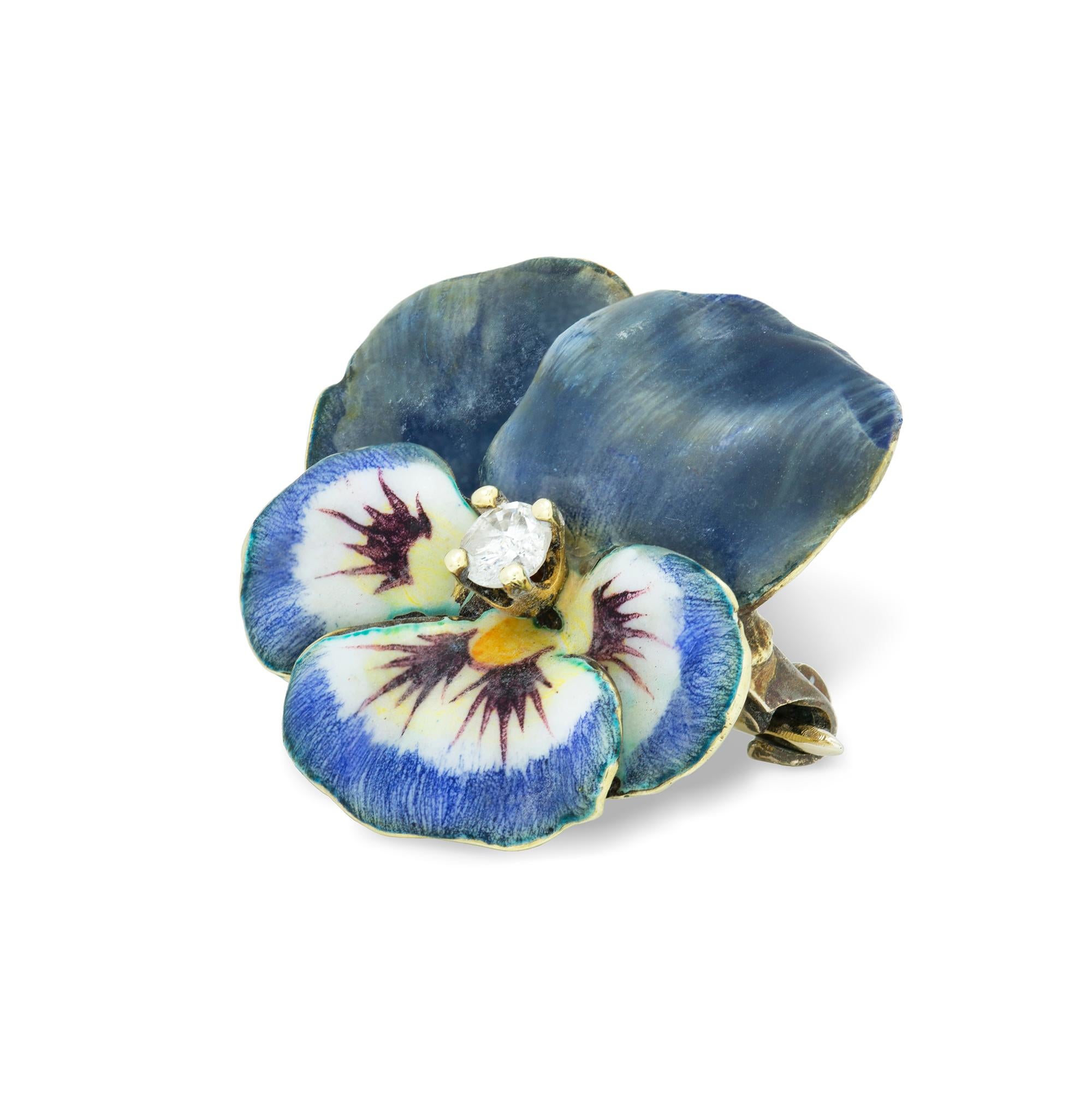 An antique enamel and diamond pansy brooch, a round old-cut diamond estimated to weight 0.15 carats, to the centre of five realistically carved and enamelled petals with 14ct yellow gold back, made in the USA circa 1900, approximately measuring 2 cm
