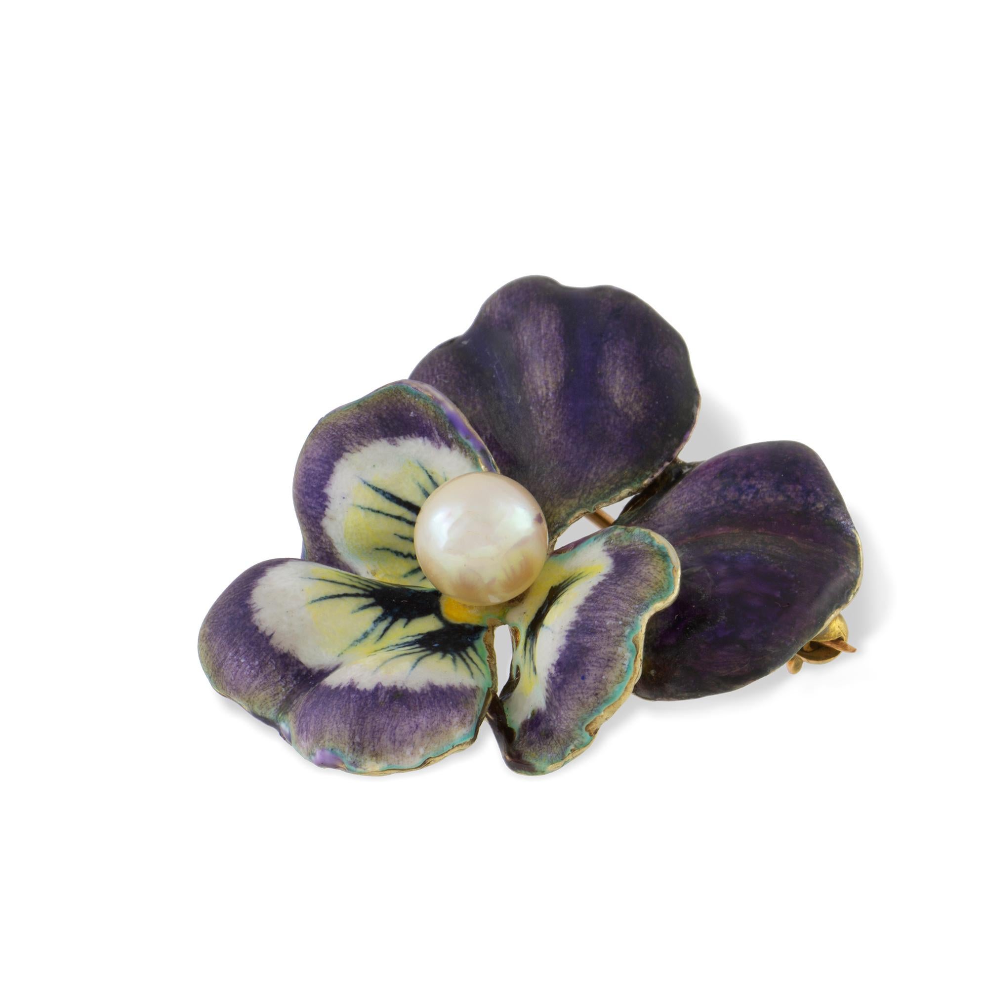 An antique enamel and pearl pansy brooch, the round pearl measuring approximately 6mm set to the centre of five realistically carved and enamelled petals with a yellow gold back with brooch and pendant fittings, made in the USA circa 1900 ,