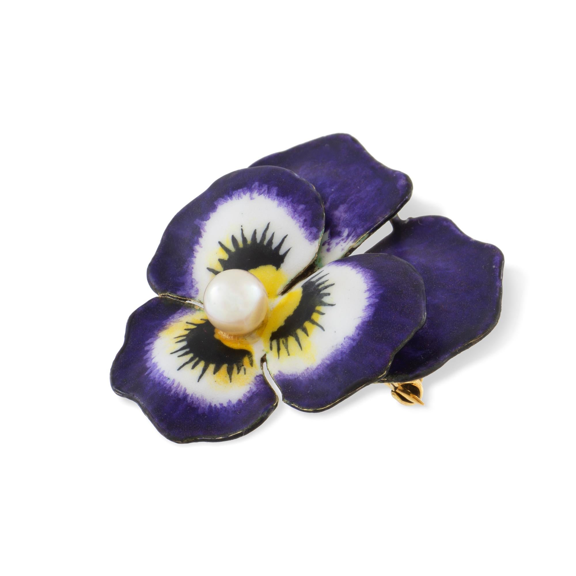 An antique enamel and pearl pansy brooch, the round pearl measuring approximately 5mm set to the centre of five realistically carved and enamelled petals with a yellow gold back with brooch fitting, stamped 14K, made in the USA circa 1900, measuring