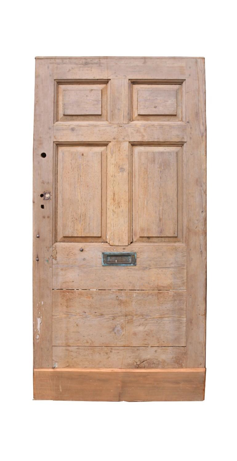 An unusual antique Georgian style front door with raised and fielded panels to the front, diagonal planks to the reverse.