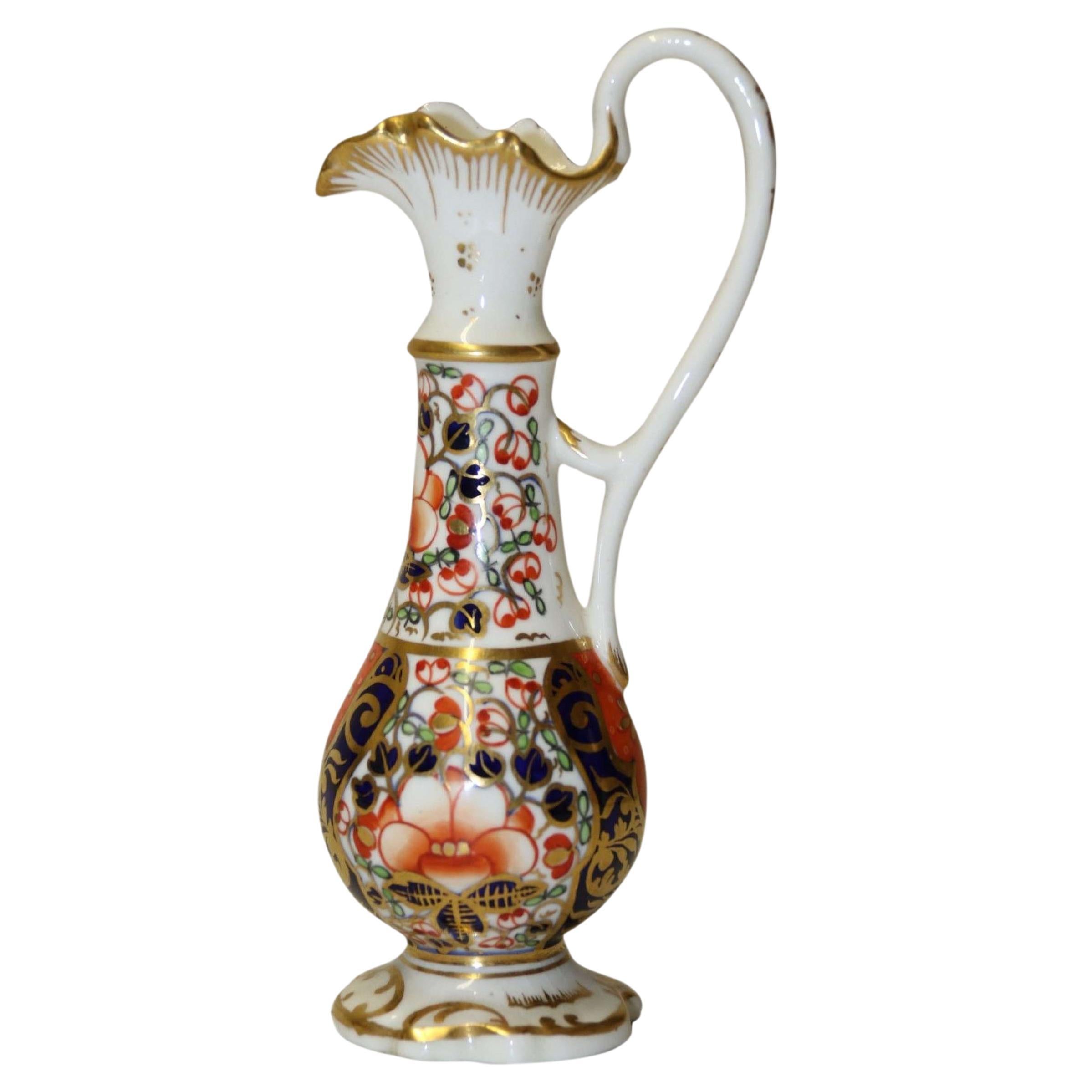 An antique English mid 19th century porcelain hand painted Derby ewer circa 1860 For Sale