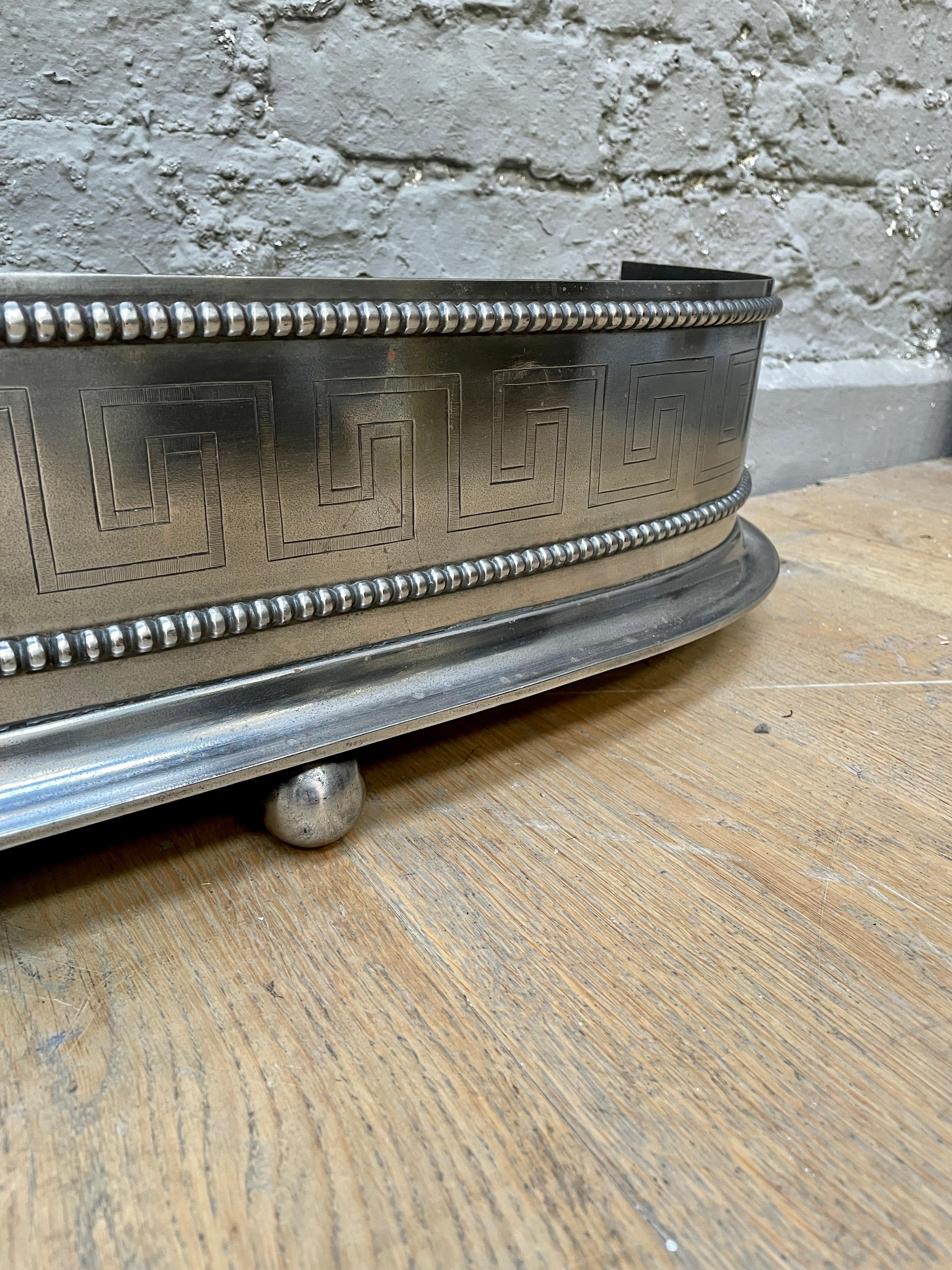19th Century An Antique English Regency Engraved Steel Fender For Sale